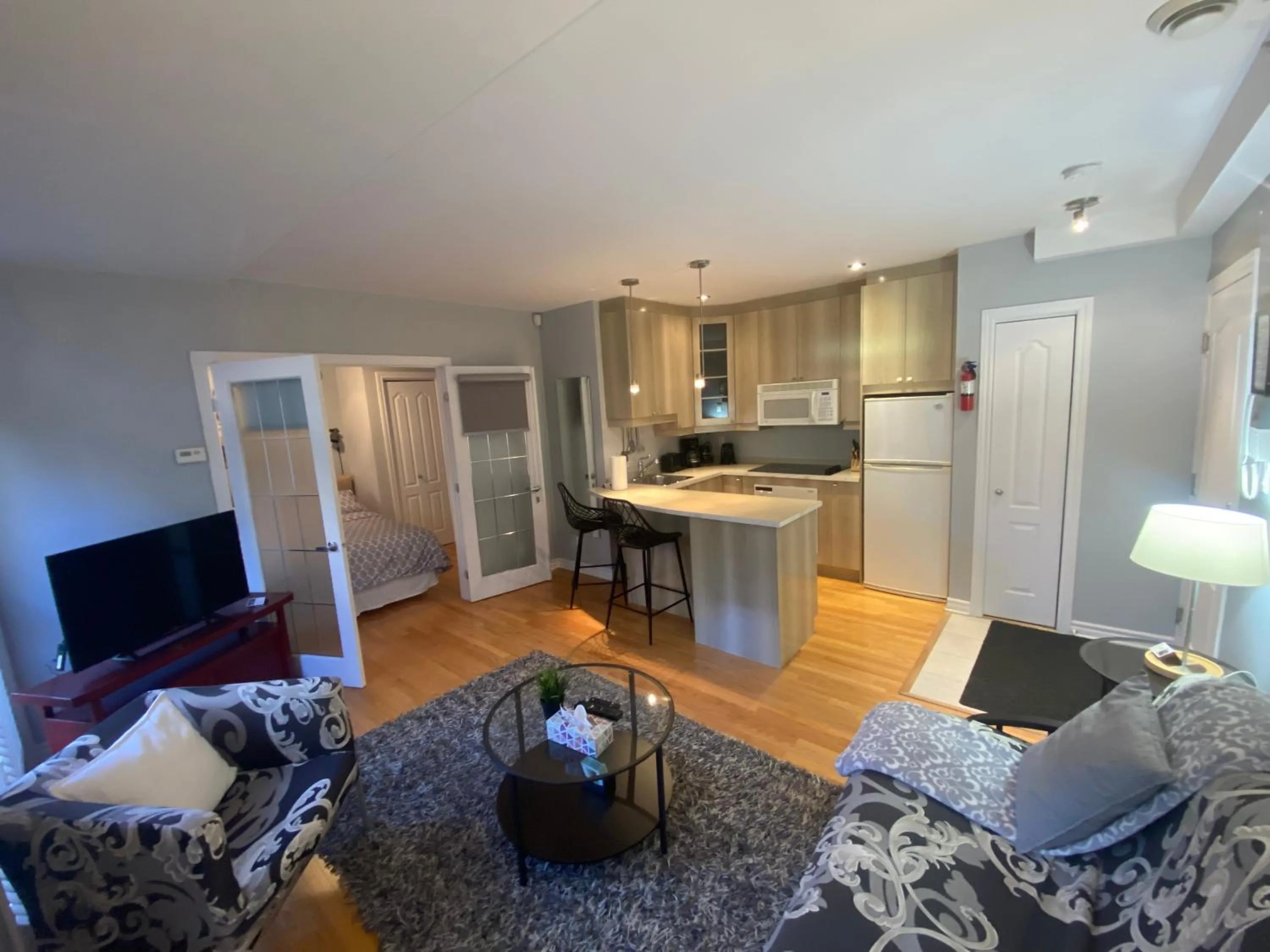 Living room in ApartHotelMontreal by Les Terrasses Saint Urbain 2225I2