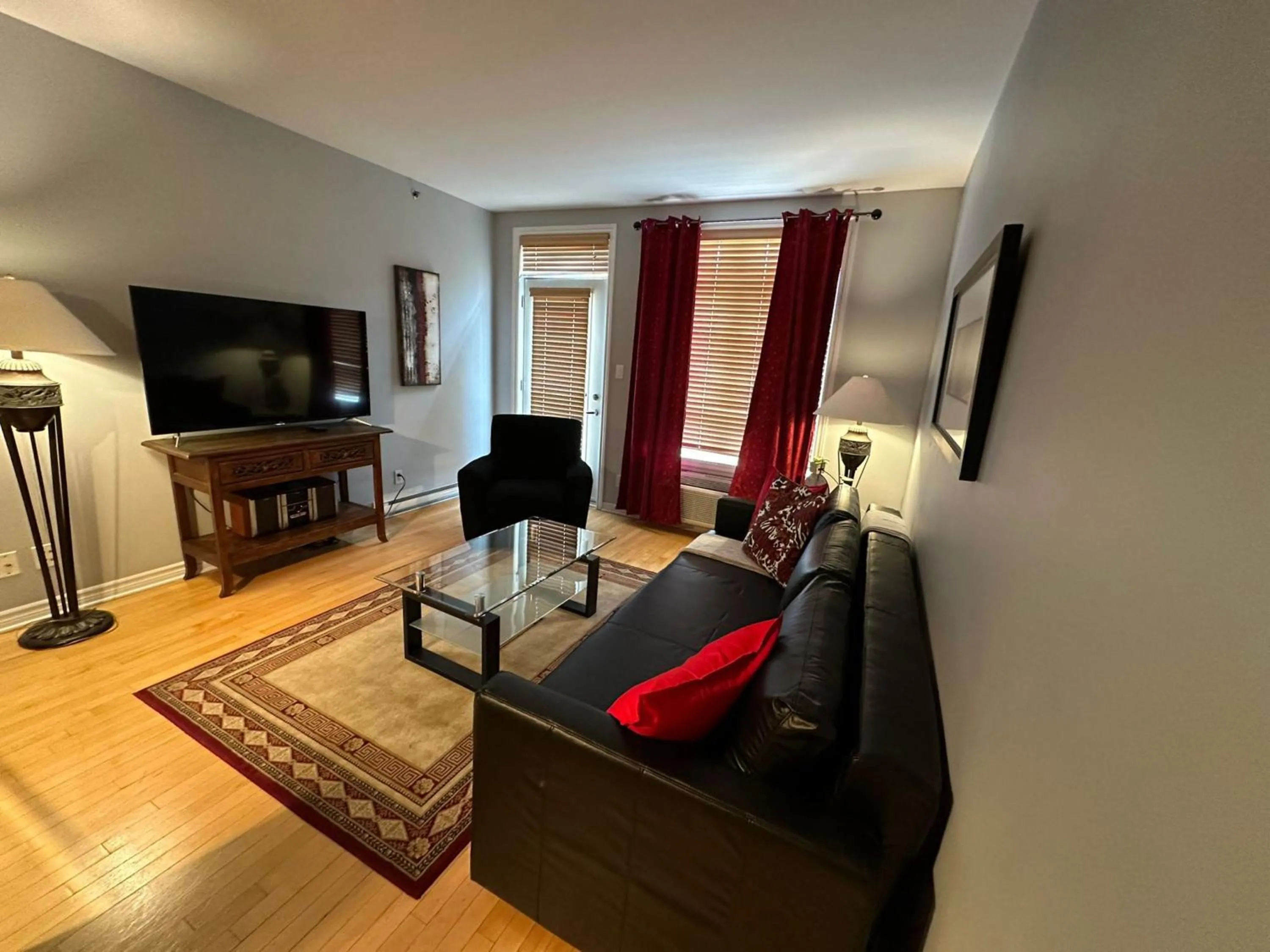 Living room in ApartHotelMontreal by Les Terrasses Saint Urbain 2225I2