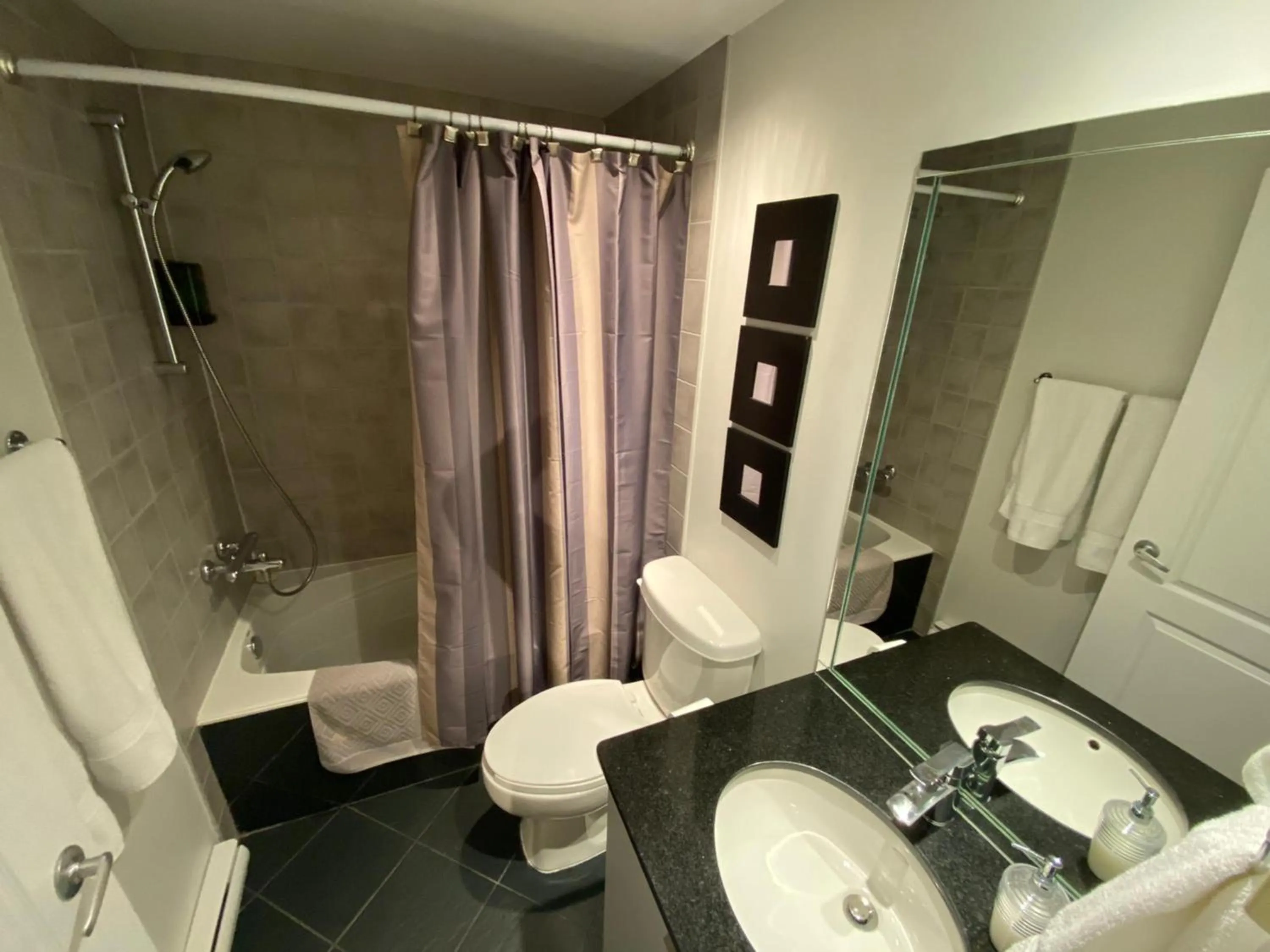 Toilet in ApartHotelMontreal by Les Terrasses Saint Urbain 2225I2