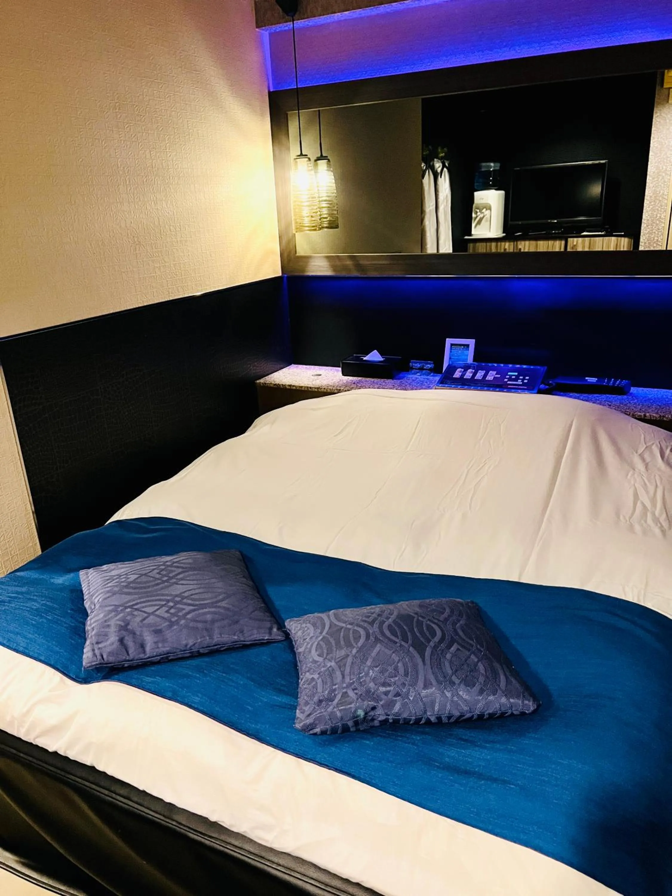 Bed in ホテル CROWN MOTEL