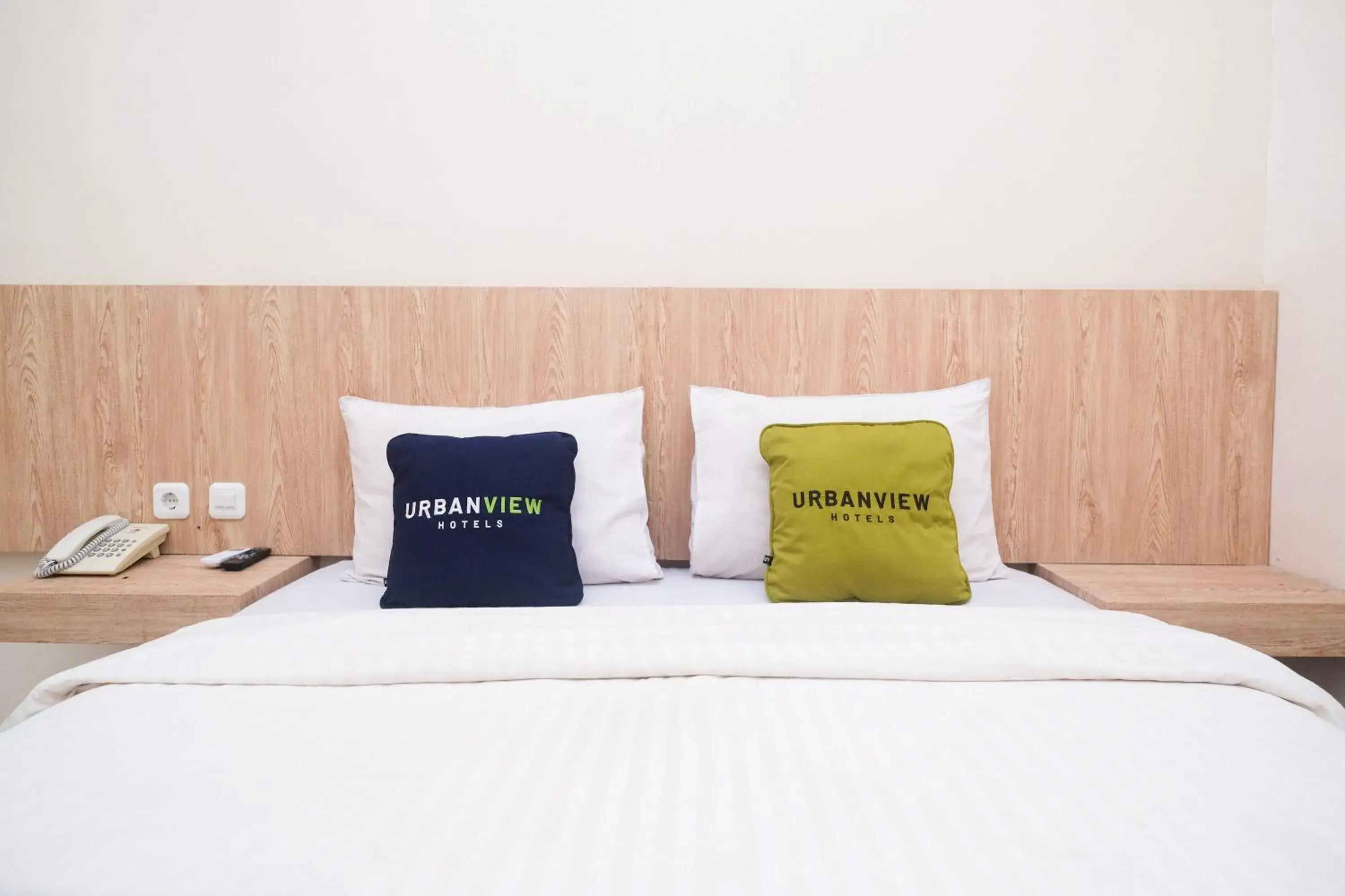 Bed in Urbanview Hotel DJ Inn Tegal Bed in Urbanview Hotel DJ Inn Tegal