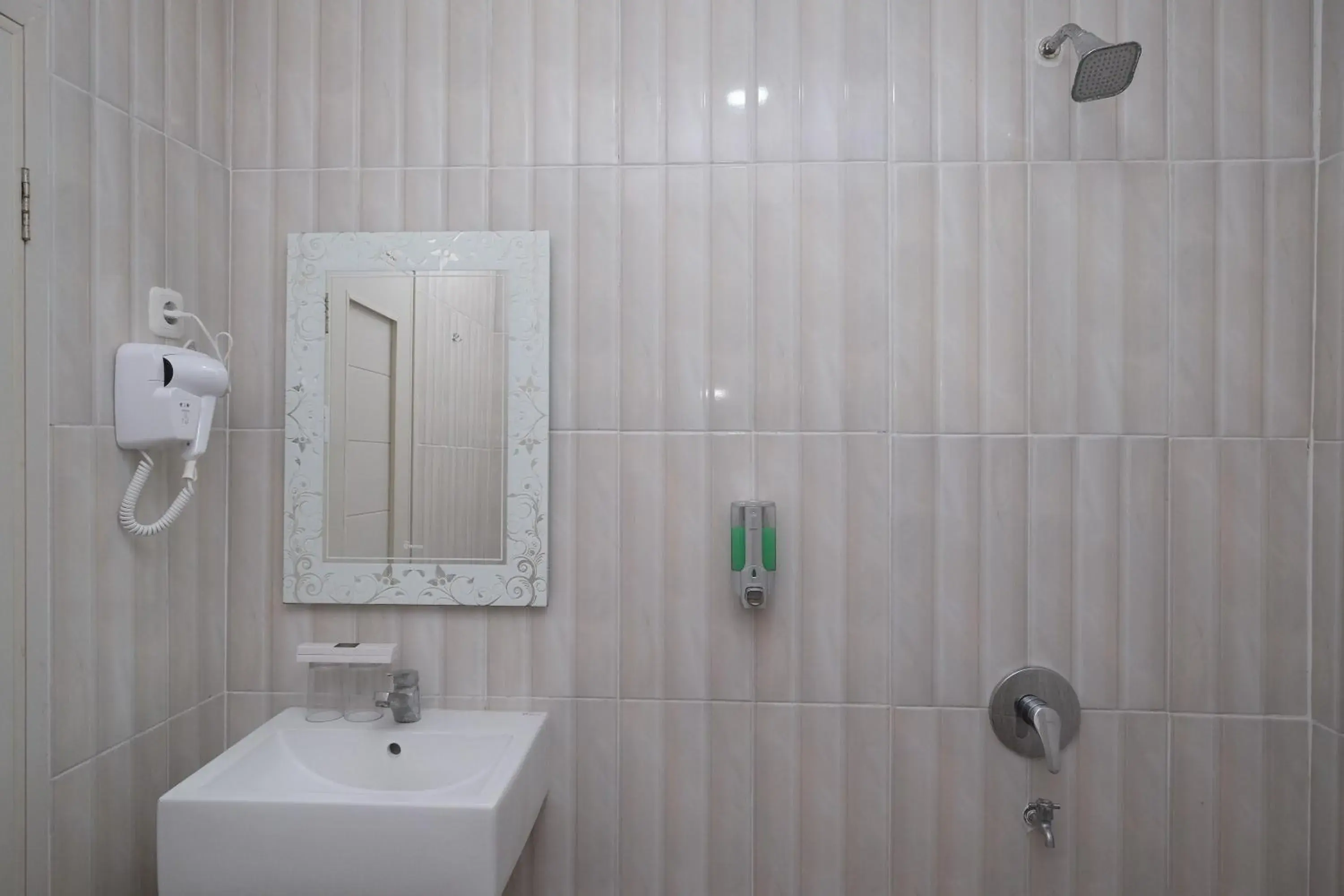 Bathroom in Urbanview Hotel DJ Inn Tegal Bathroom in Urbanview Hotel DJ Inn Tegal