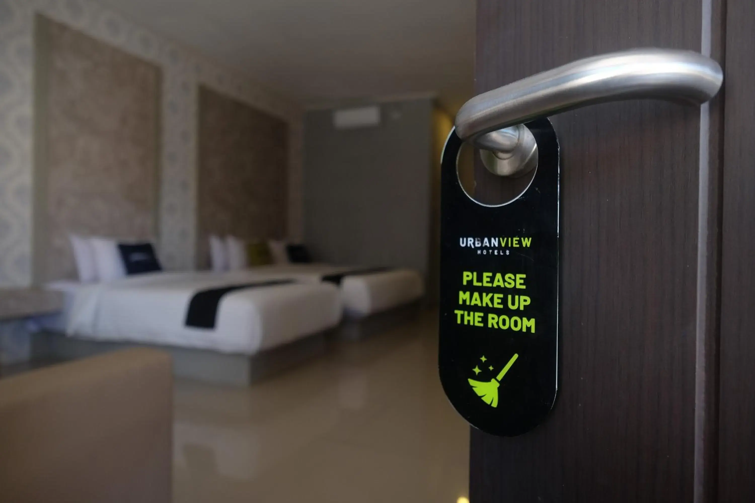 Bed in Urbanview Hotel DJ Inn Tegal Bed in Urbanview Hotel DJ Inn Tegal