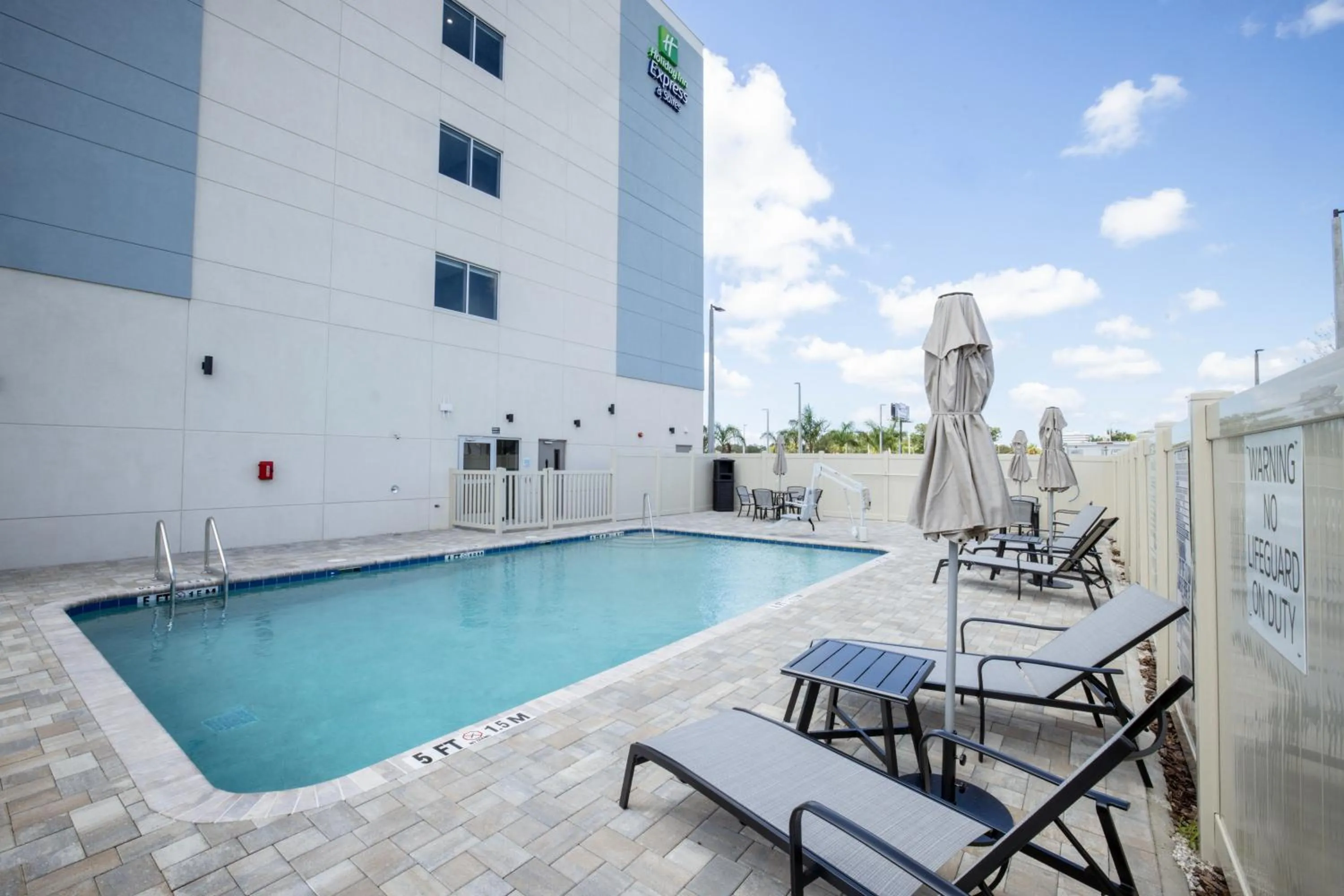 Swimming pool in Holiday Inn Express & Suites Tampa Stadium - Airport Area by IHG