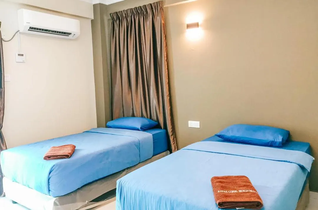 Bed in Kapas Coral Beach Resort