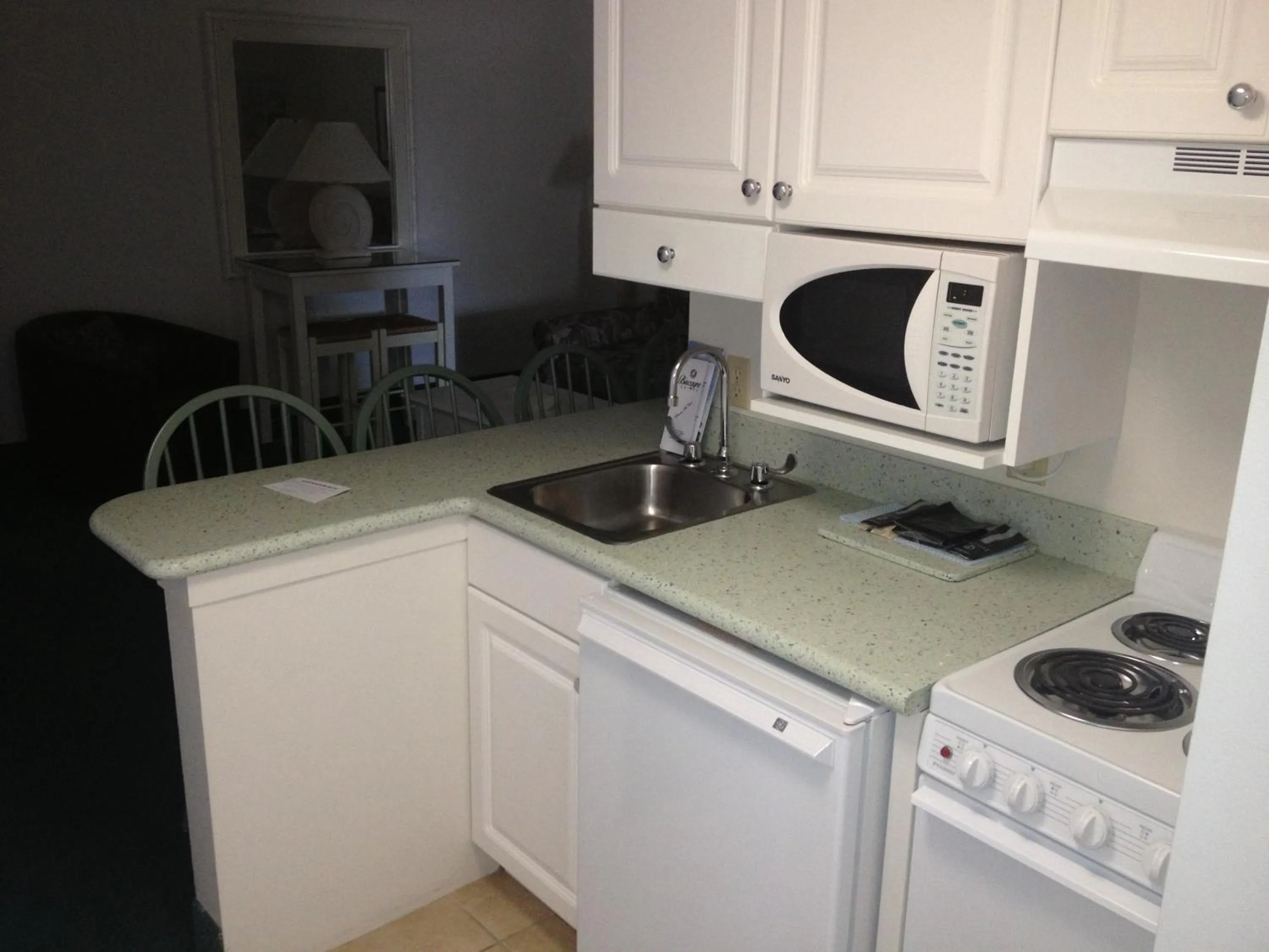 Kitchen or kitchenette in Biscayne Suites