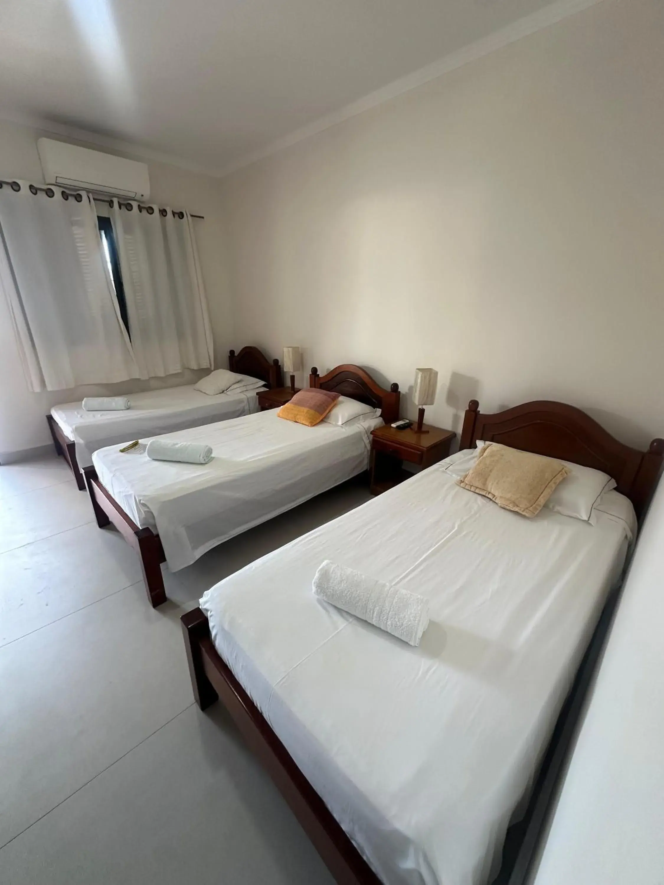 Triple Room with 3 Single Beds in Pousada Acqua Azul Triple Room with 3 Single Beds in Pousada Acqua Azul