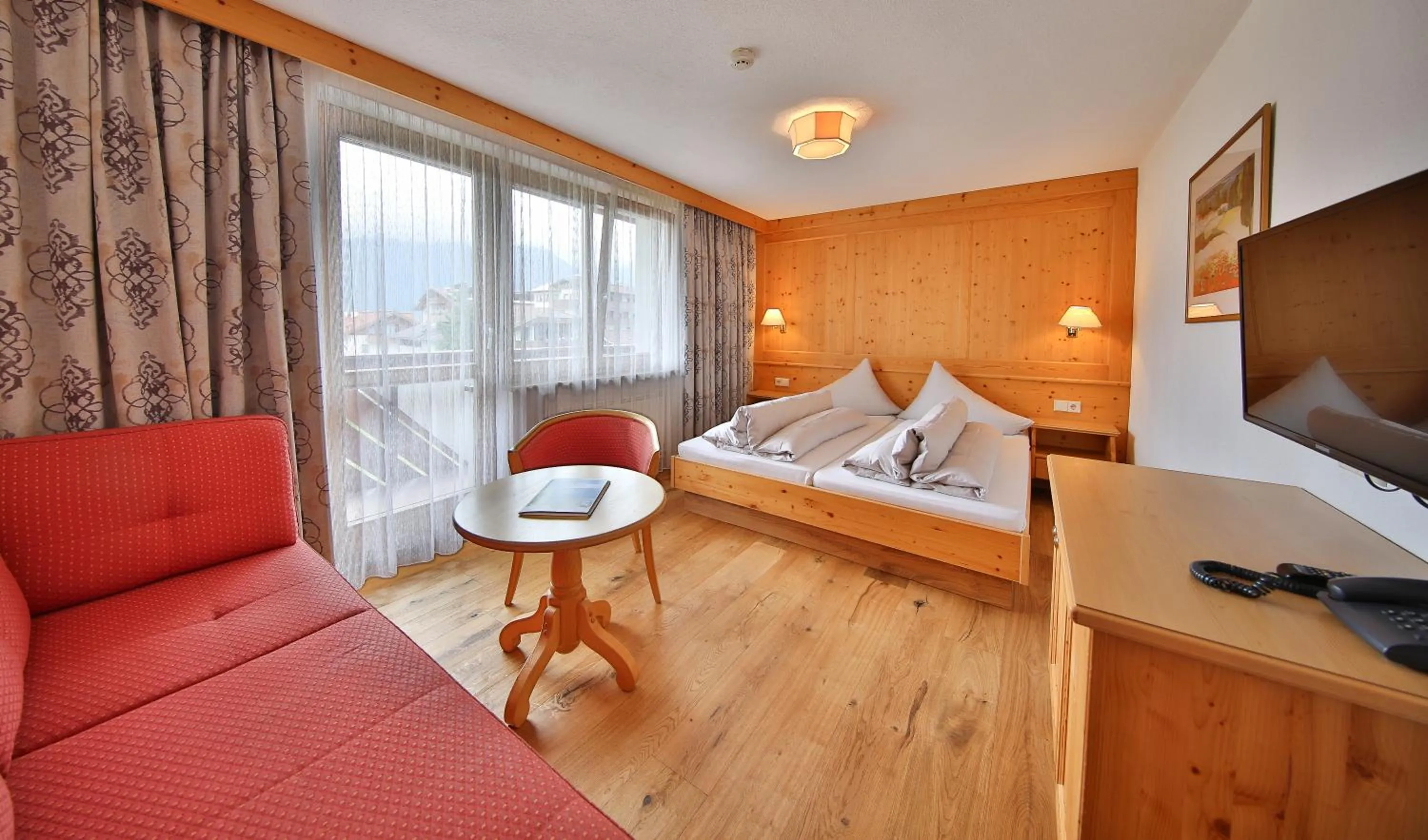 Living room, Bed in Hotel Astoria