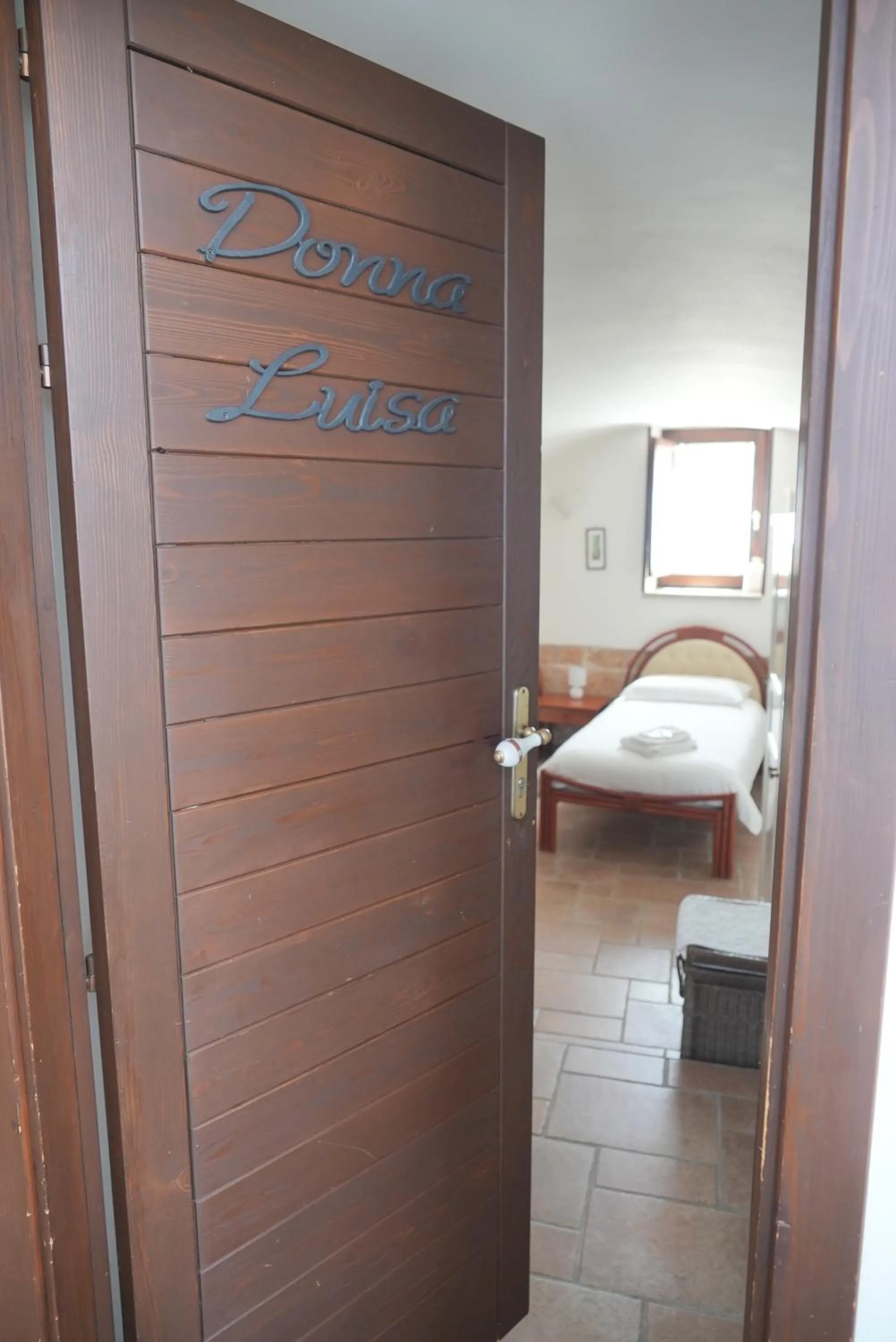 Bed in B&B Donna Luisa