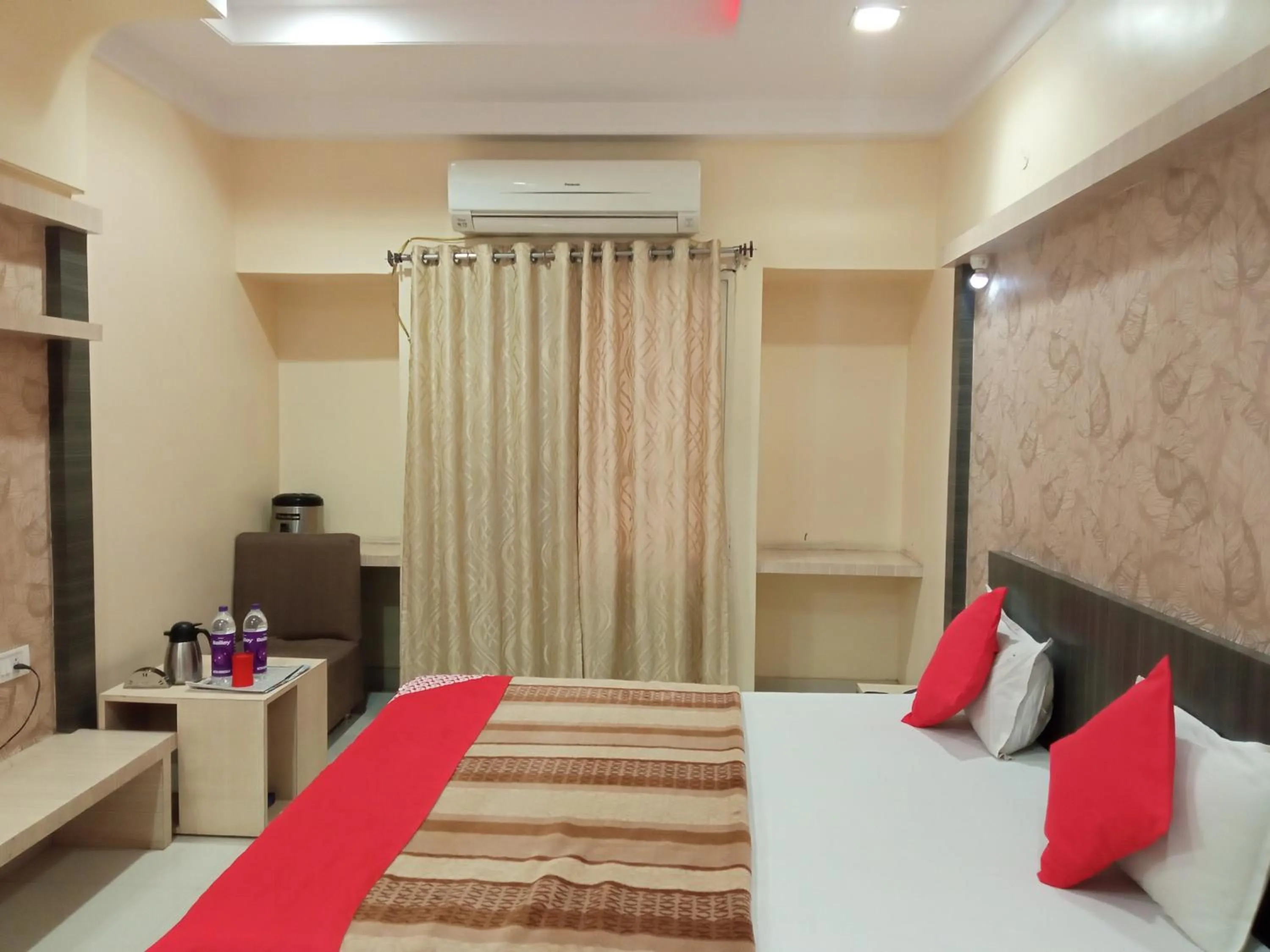 Photo of the whole room, Bed in Pachmarhi Shri Krishna Hotel