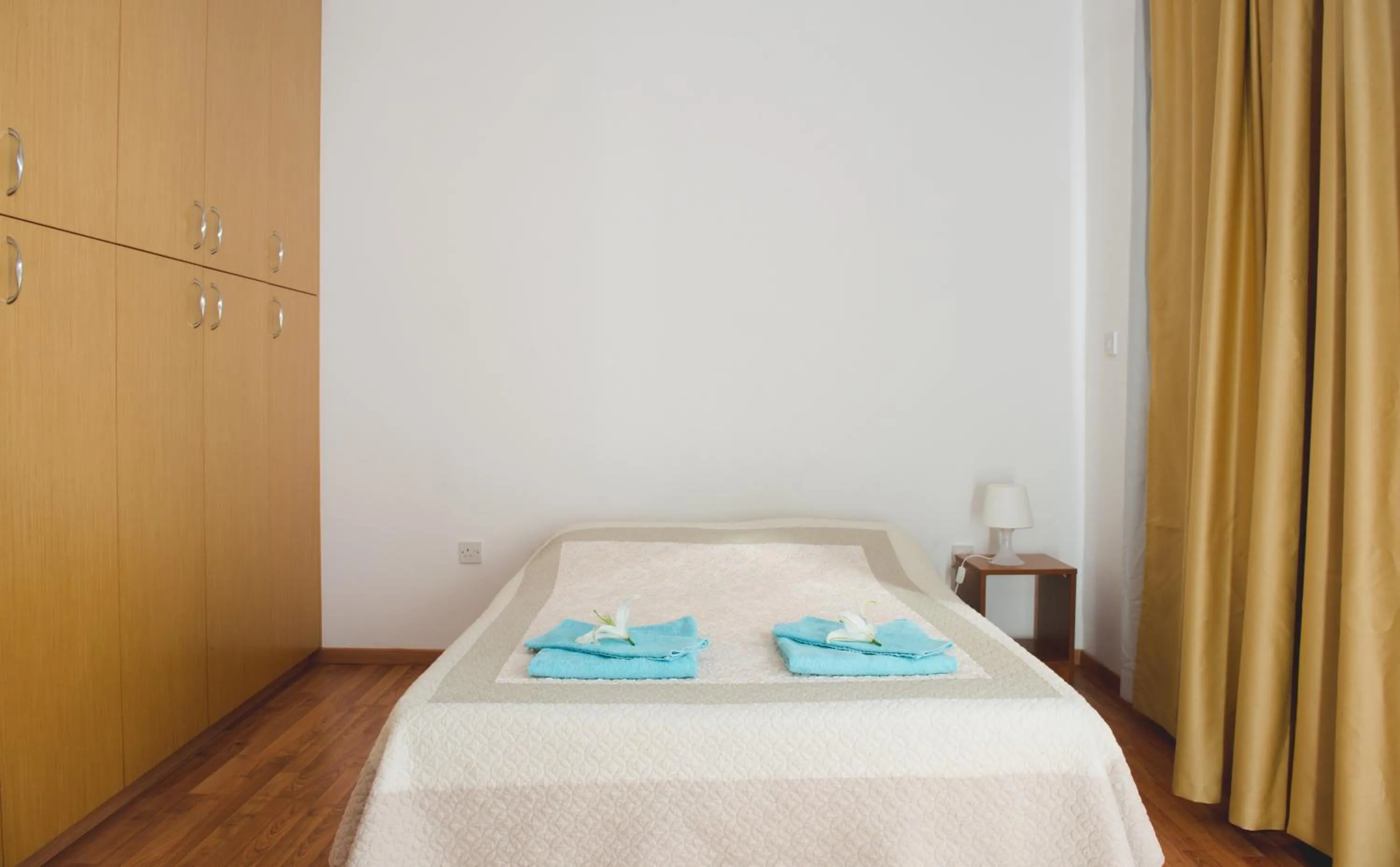 Bed in Valentinos Apartments