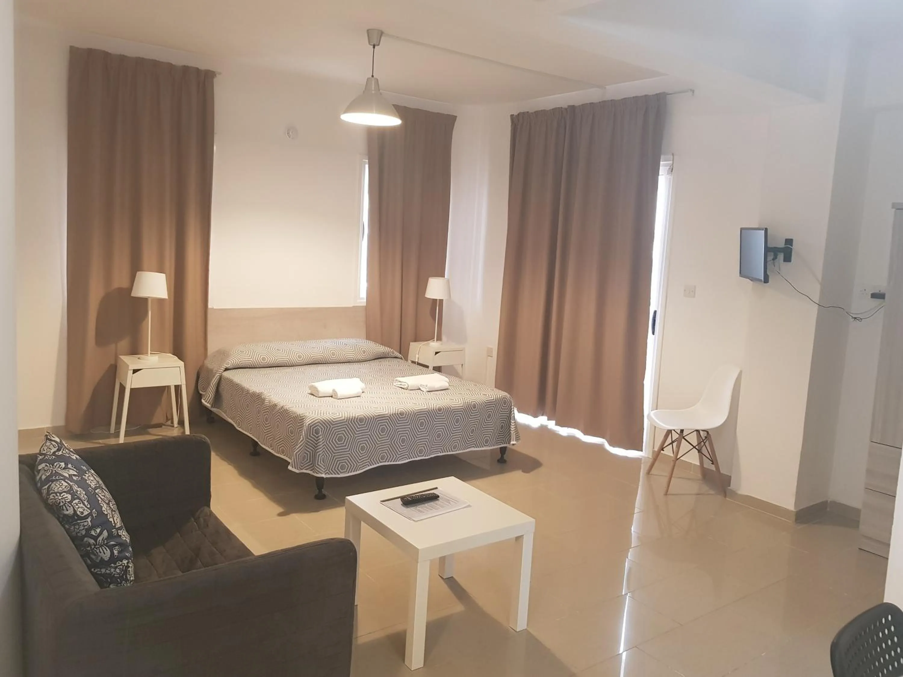 Bed in Valentinos Apartments