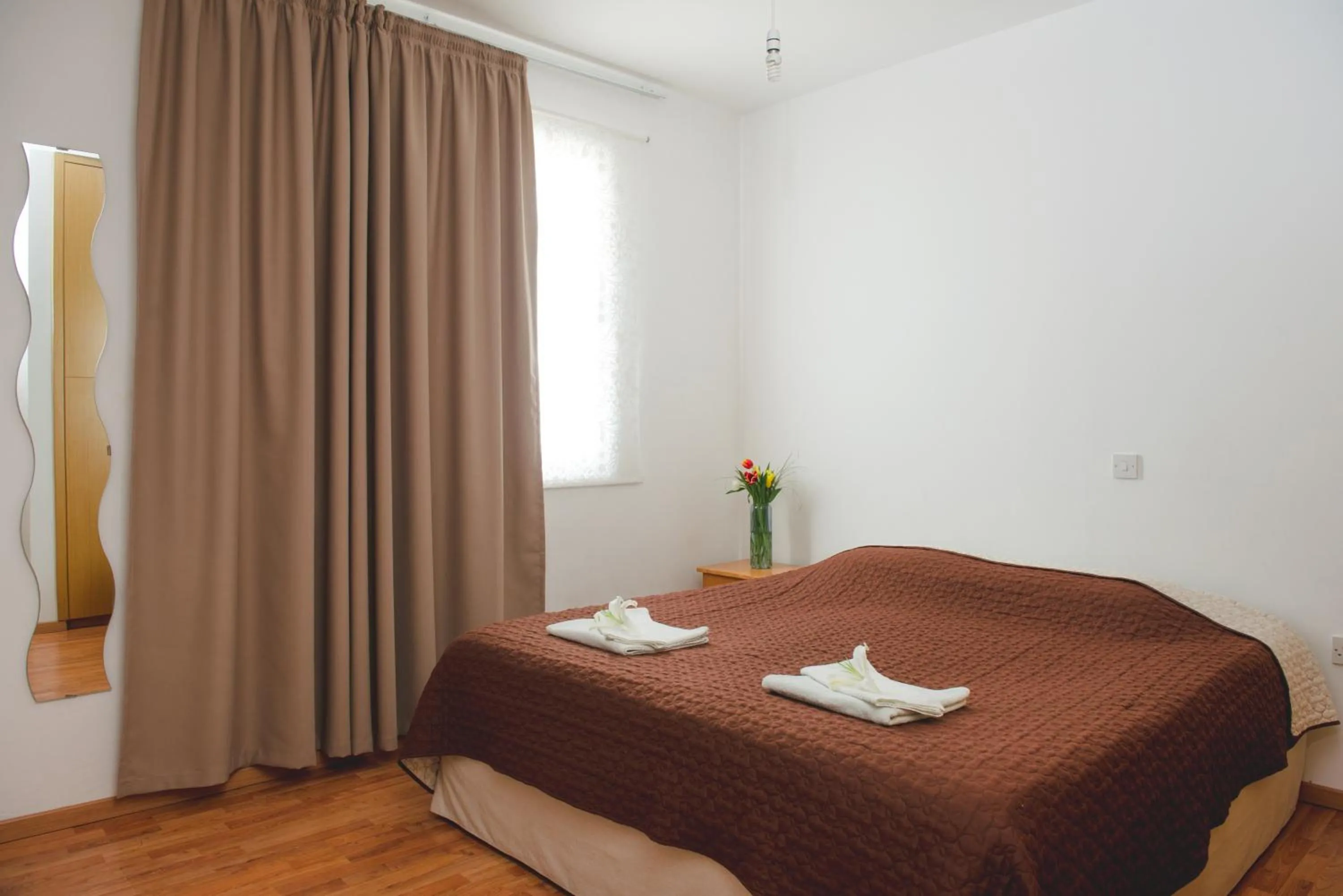 Bed in Valentinos Apartments