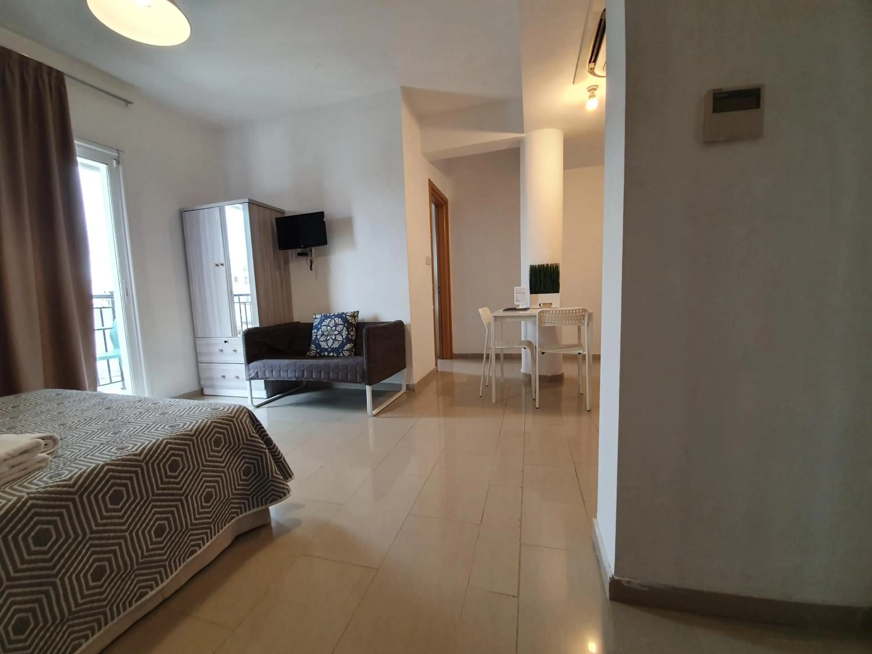 Bed in Valentinos Apartments