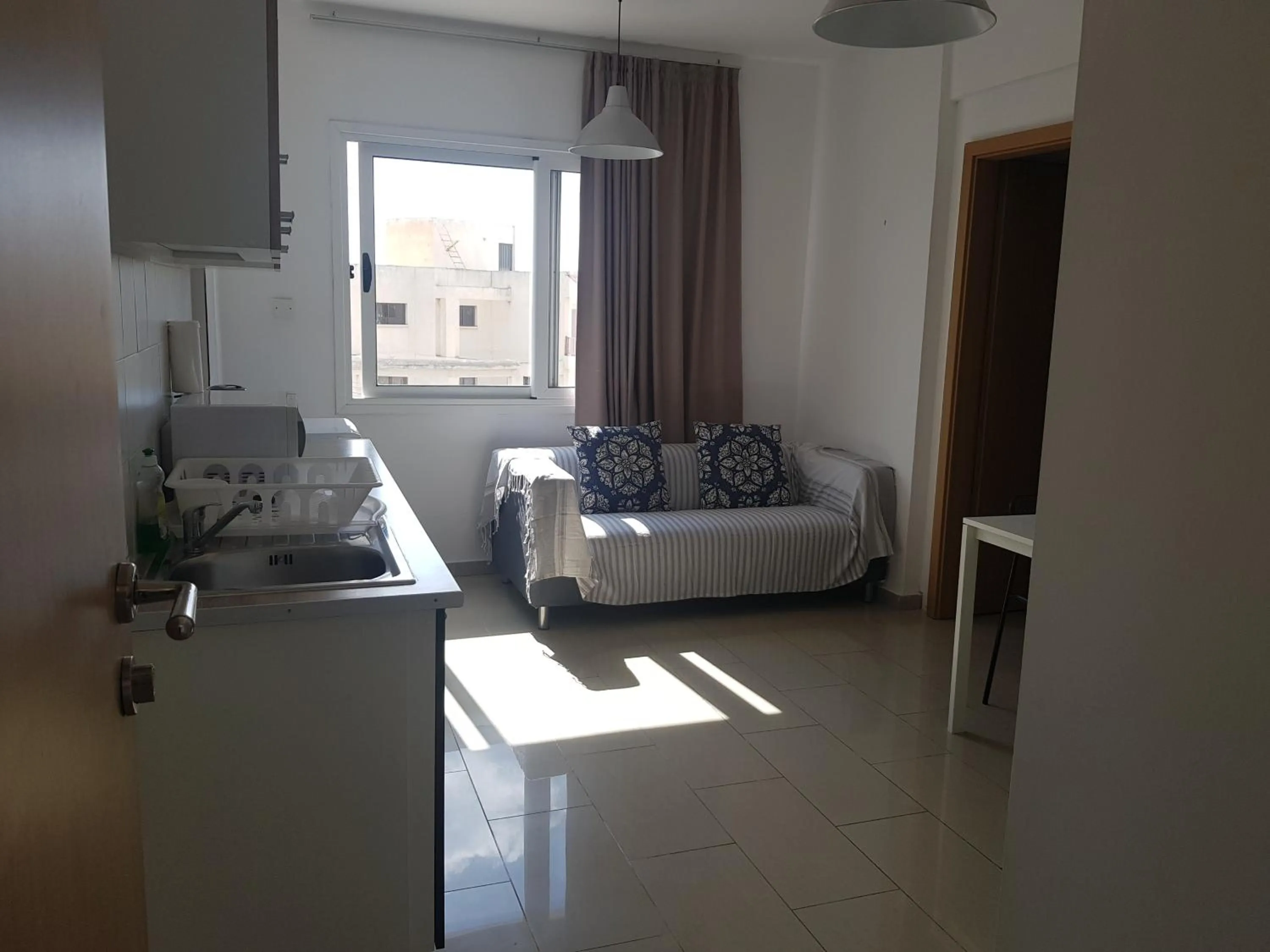 Bed in Valentinos Apartments