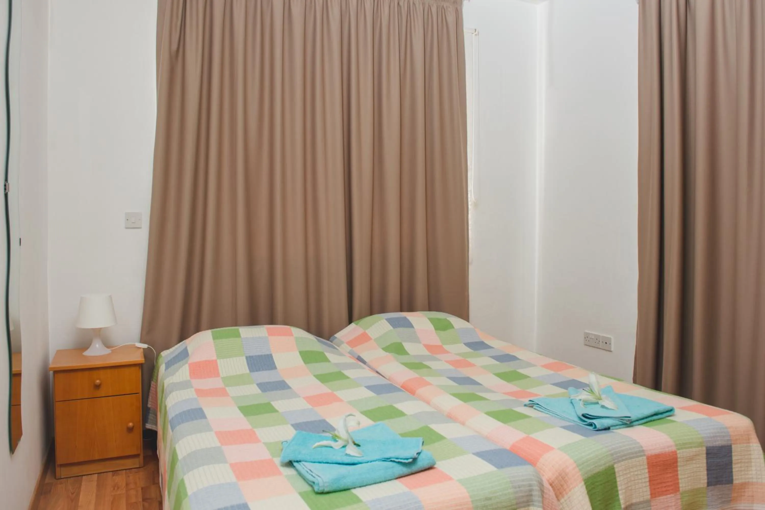 Bed in Valentinos Apartments