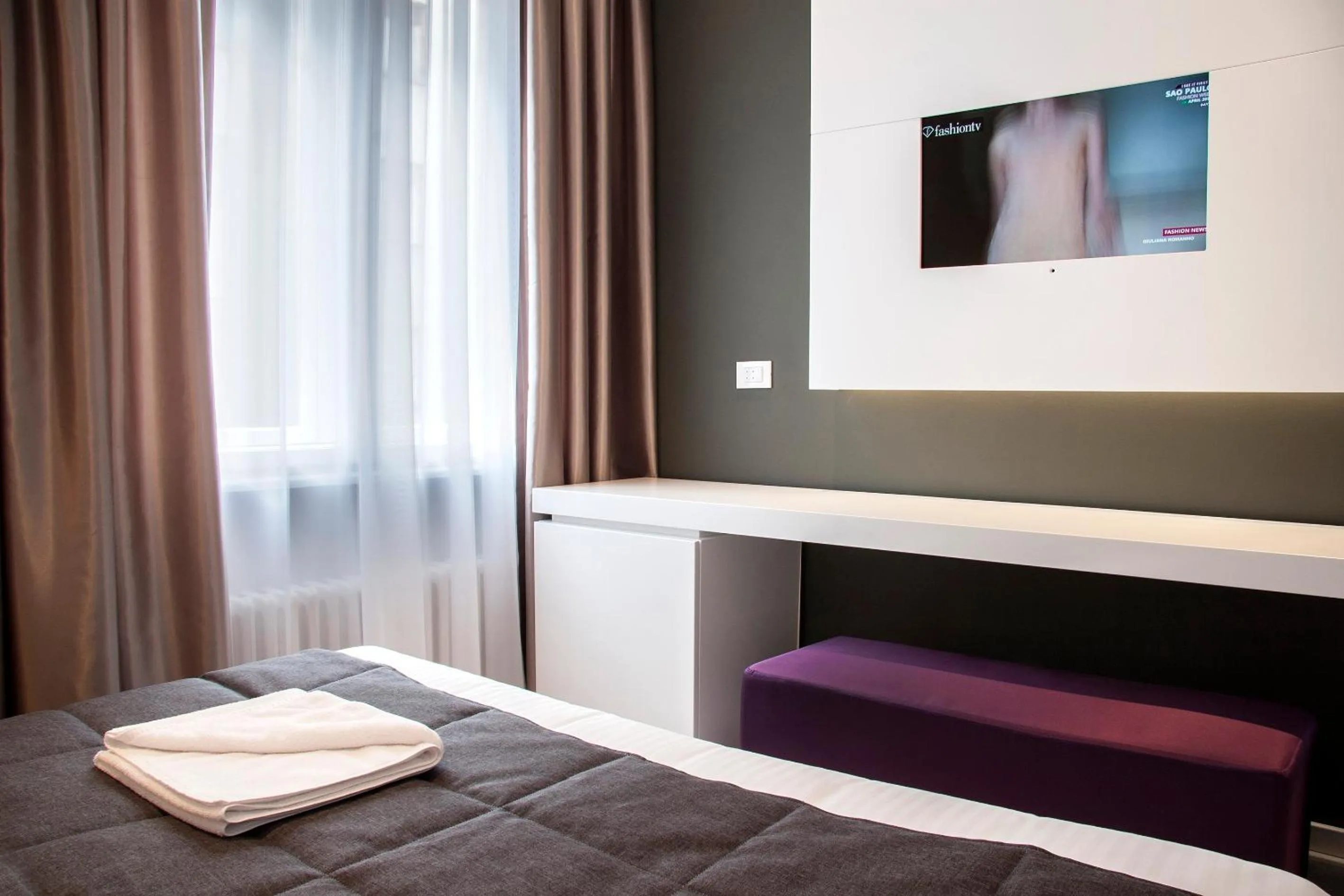 Bed in Eden Garden Suites