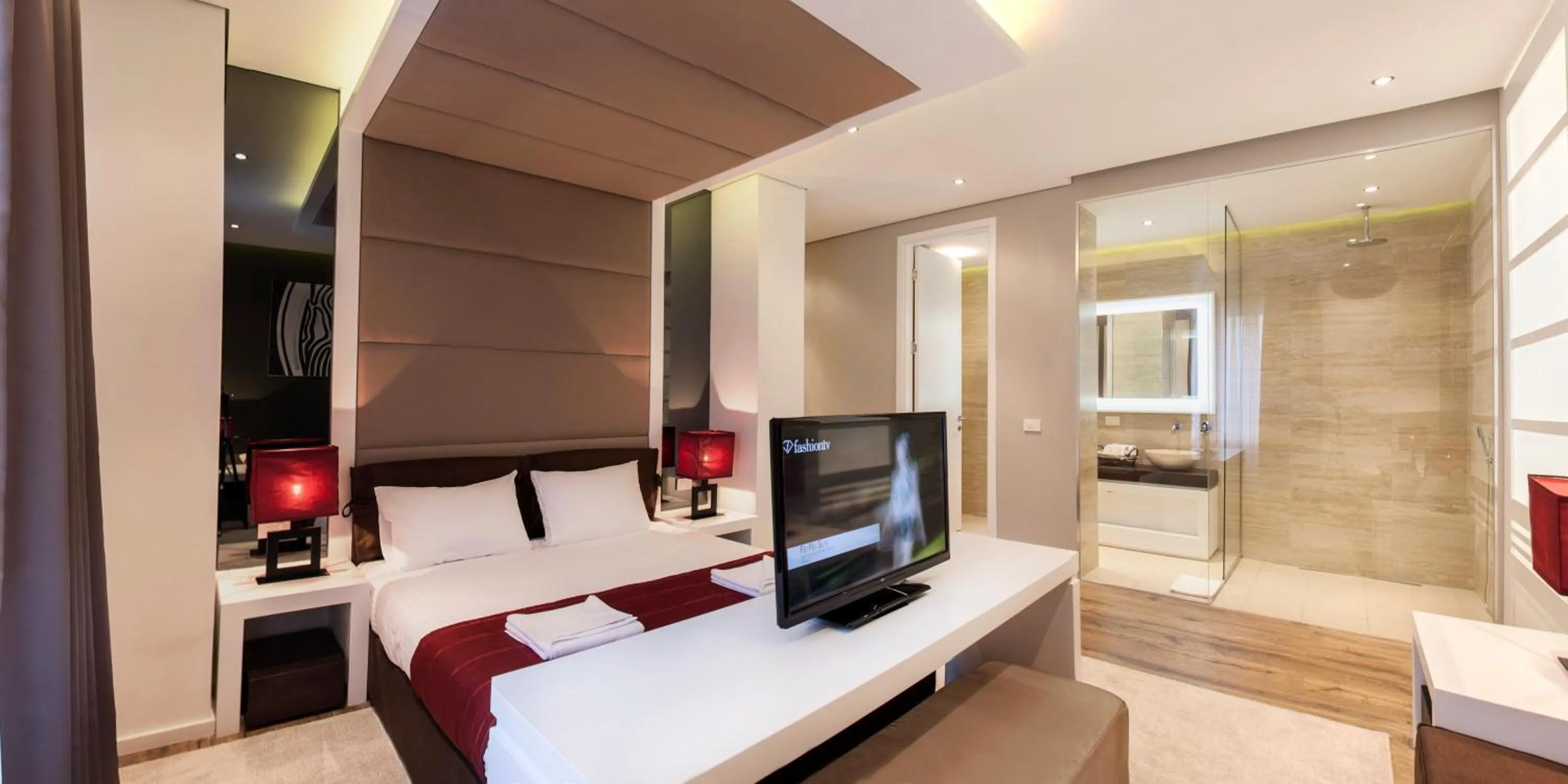 Bed in Eden Garden Suites