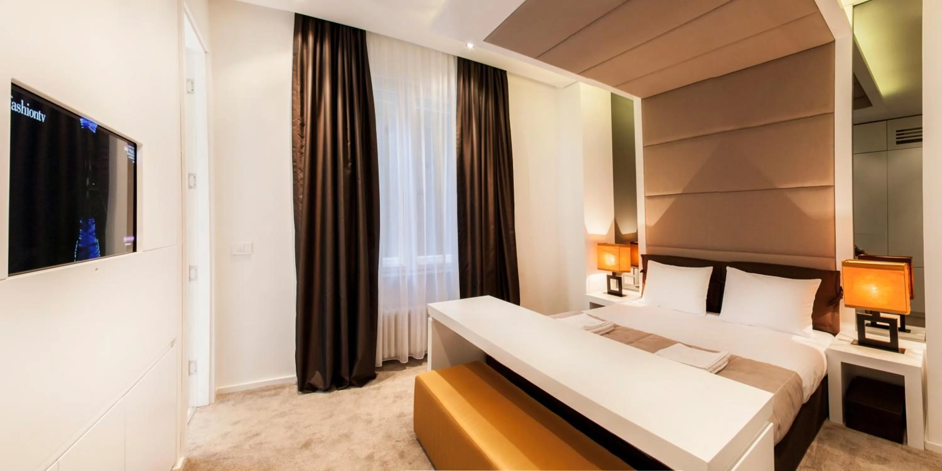 Bed in Eden Garden Suites