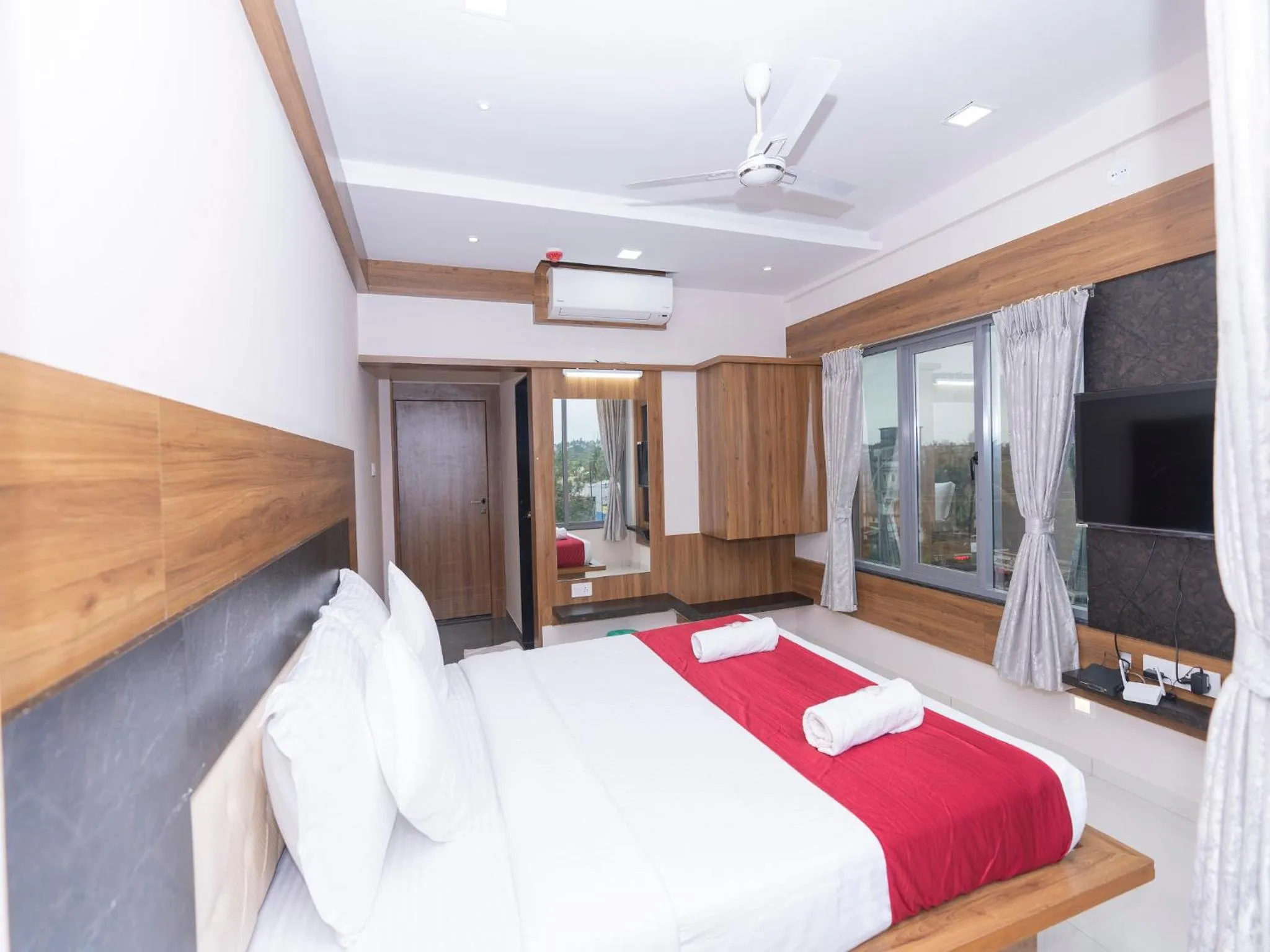 Photo of the whole room, Bed in Hotel Chiranjeevi Kolhapur