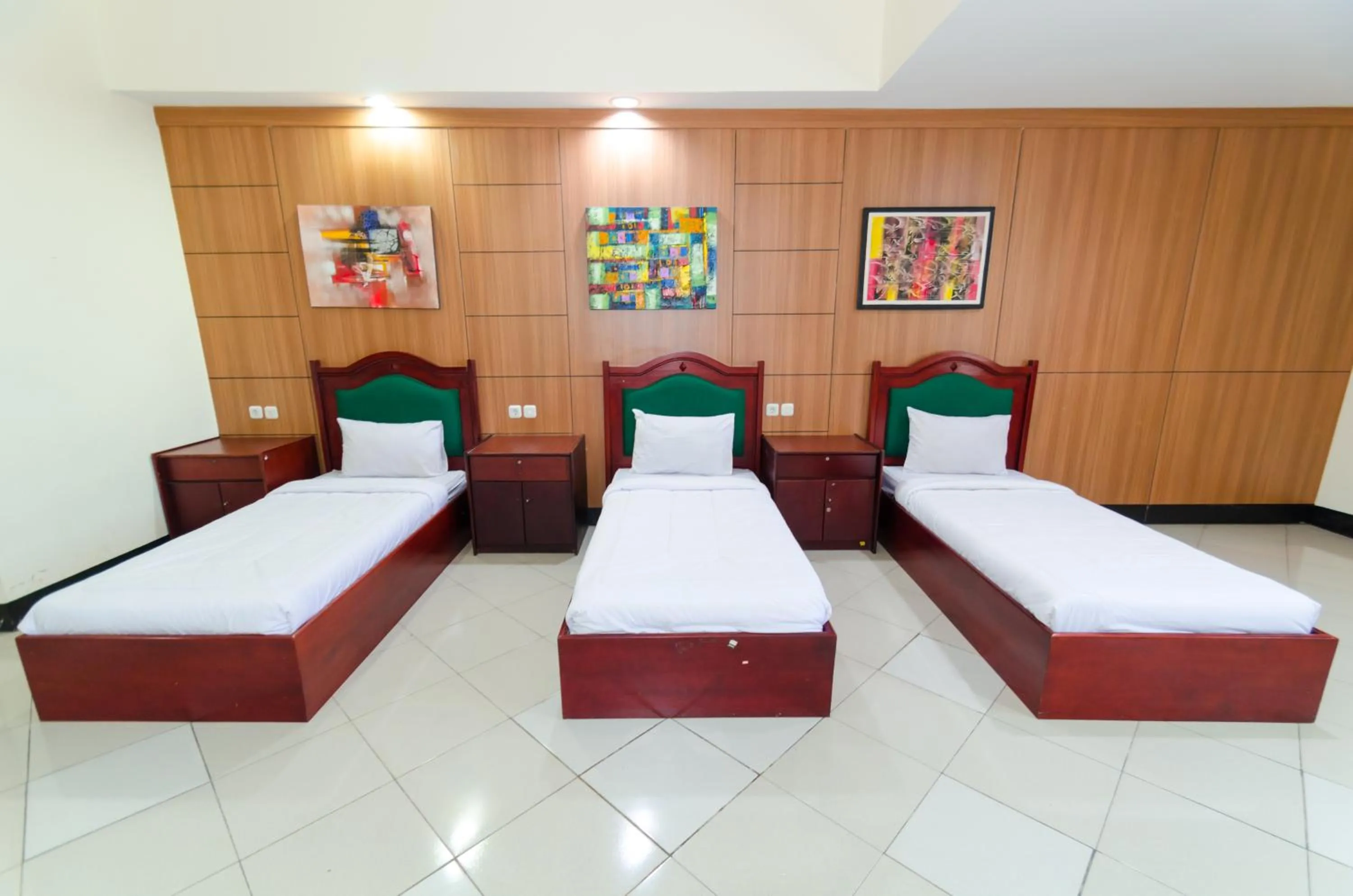 Bed in Graha Widya Bhakti at STIESIA Surabaya
