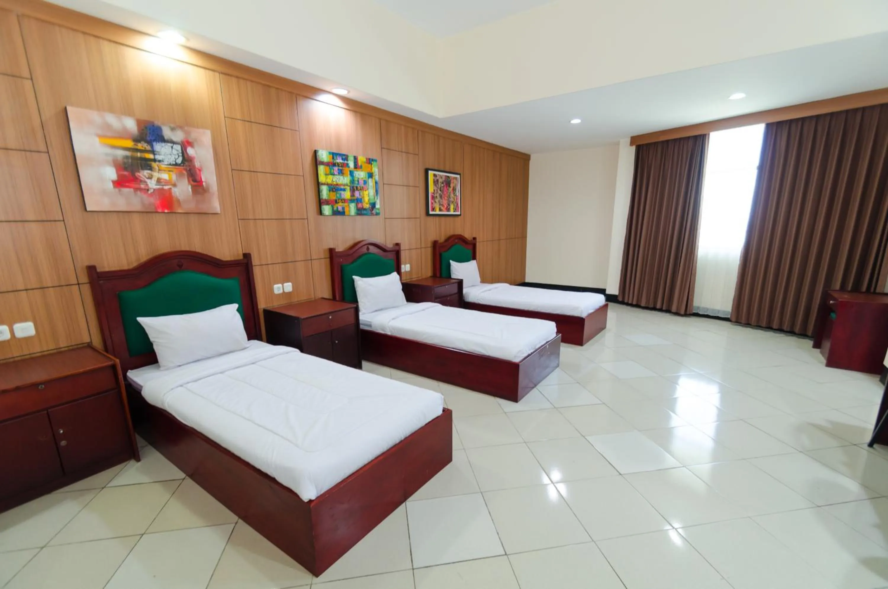 Bed in Graha Widya Bhakti at STIESIA Surabaya