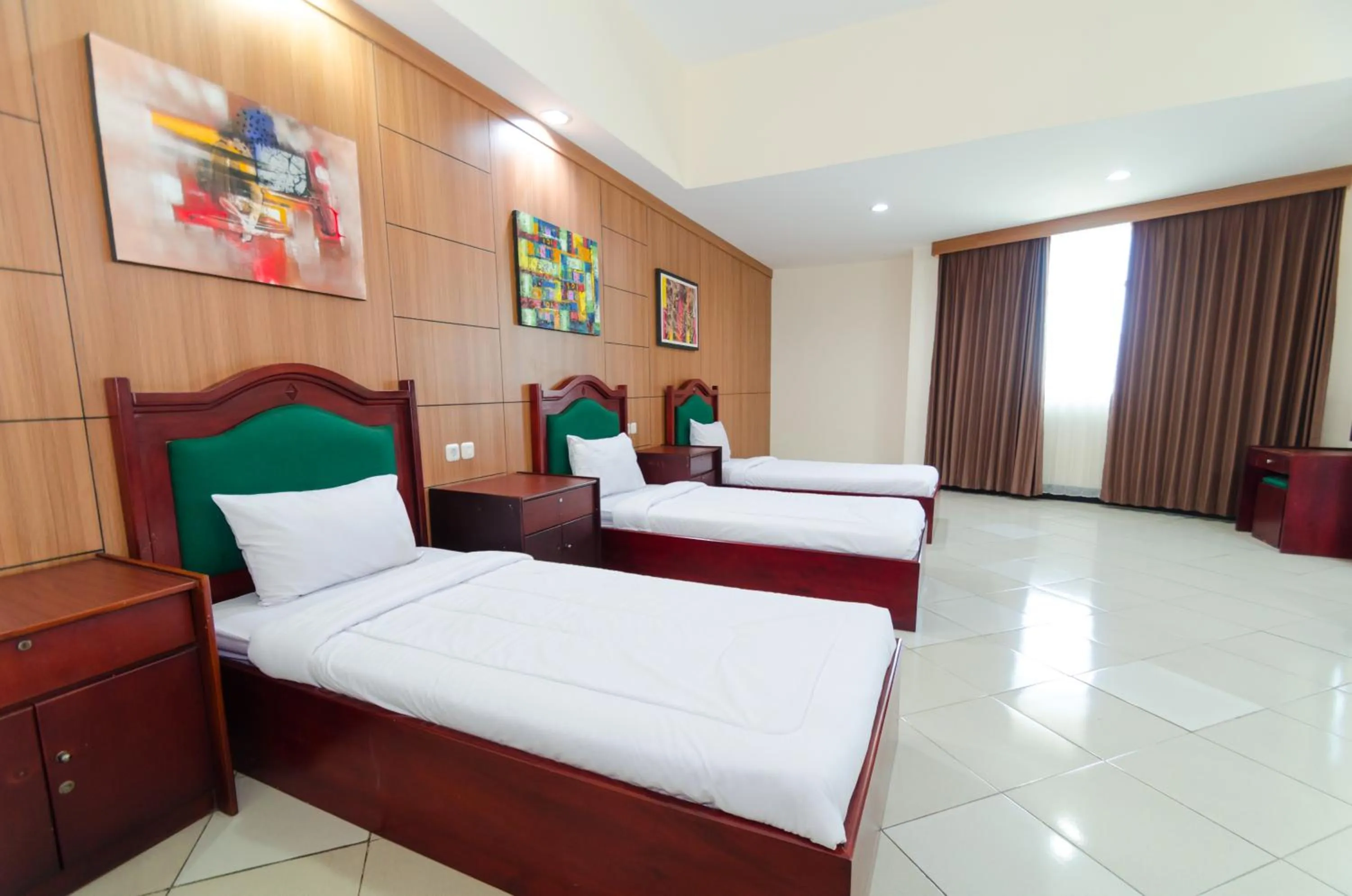 Bed in Graha Widya Bhakti at STIESIA Surabaya