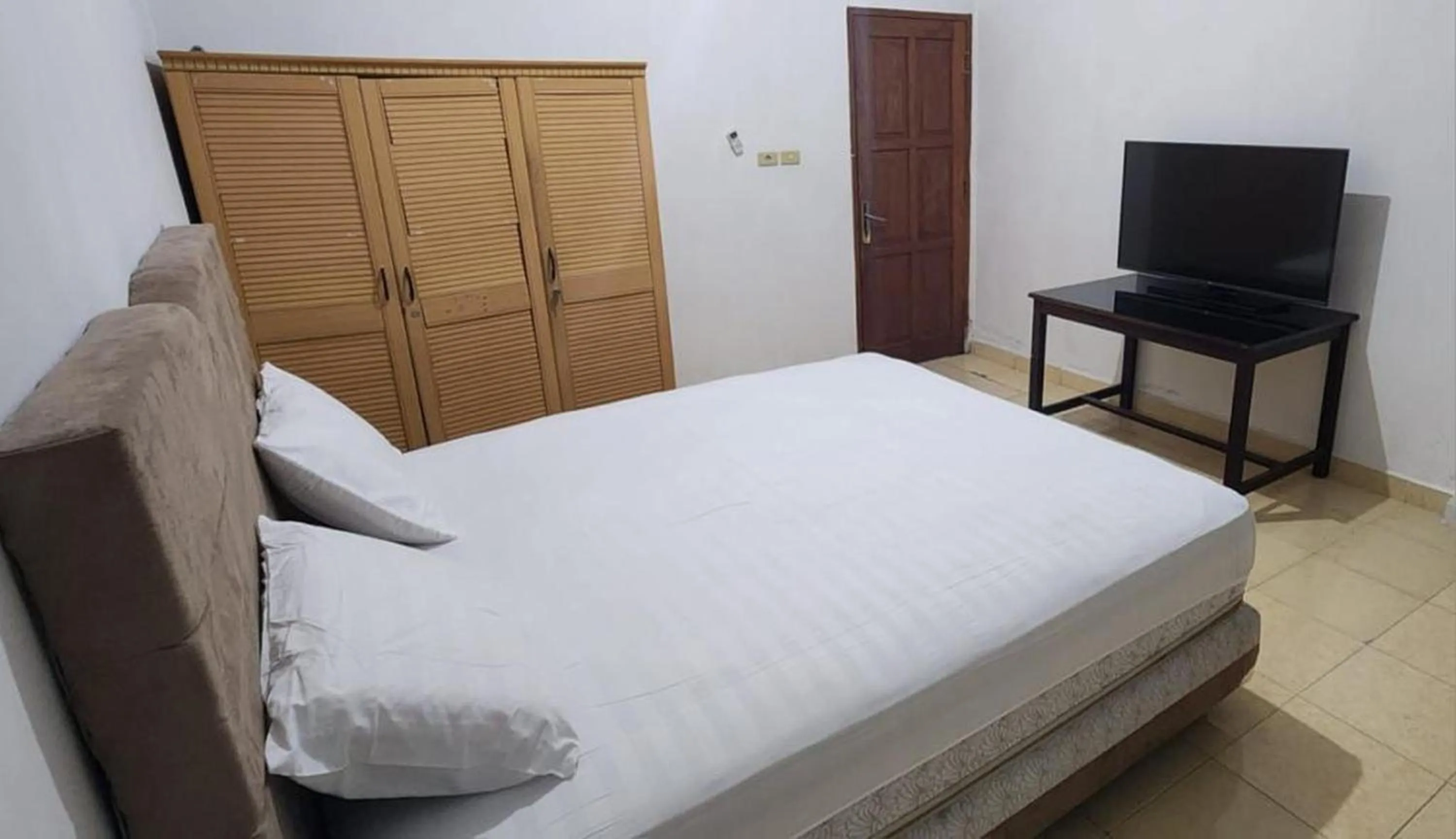 Bedroom in Permata Homestay Kotamobagu Mitra RedDoorz