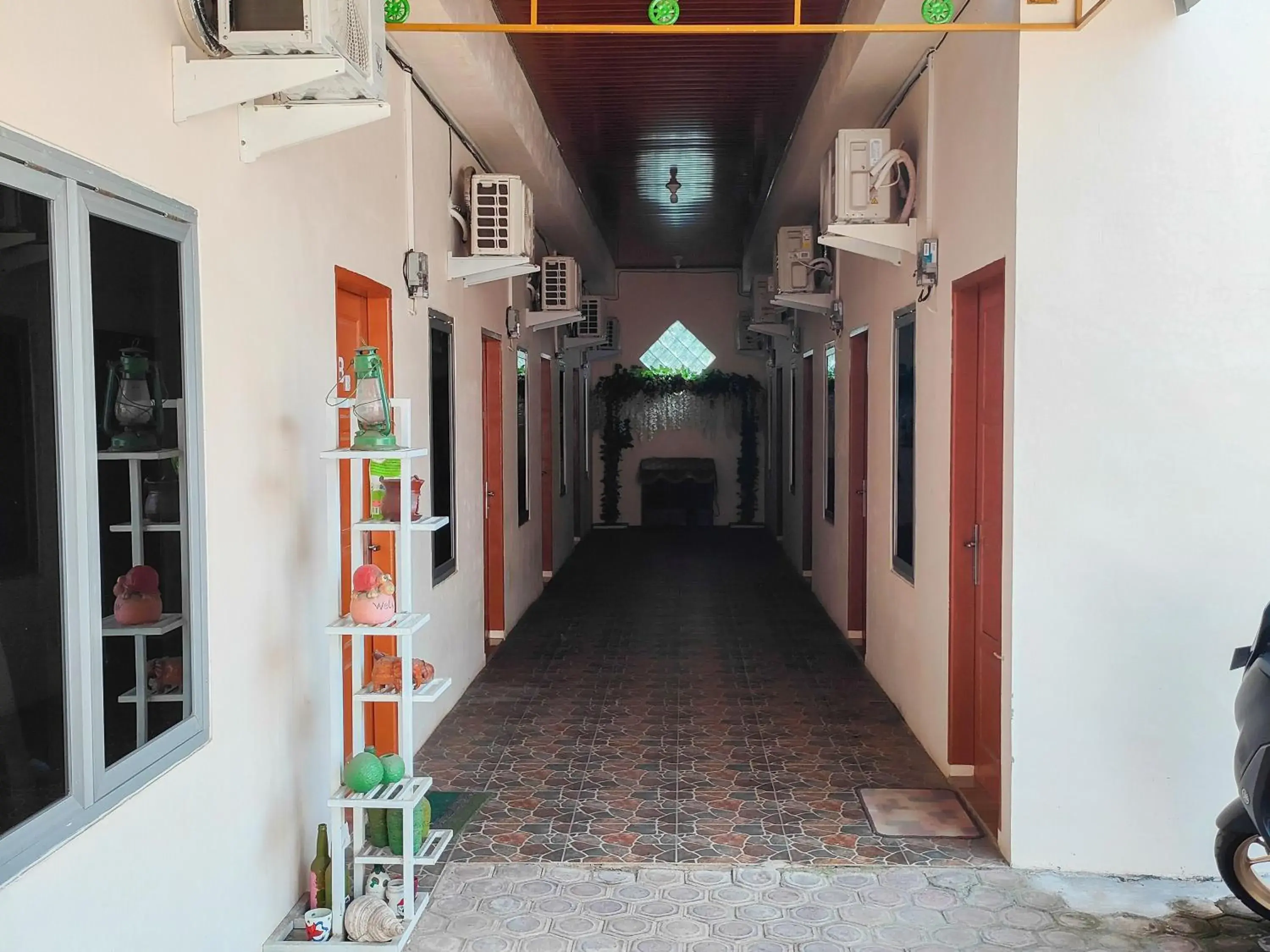 Facade/entrance in New Era Family Homestay Binjai Mitra RedDoorz Facade/entrance in New Era Family Homestay Binjai Mitra RedDoorz