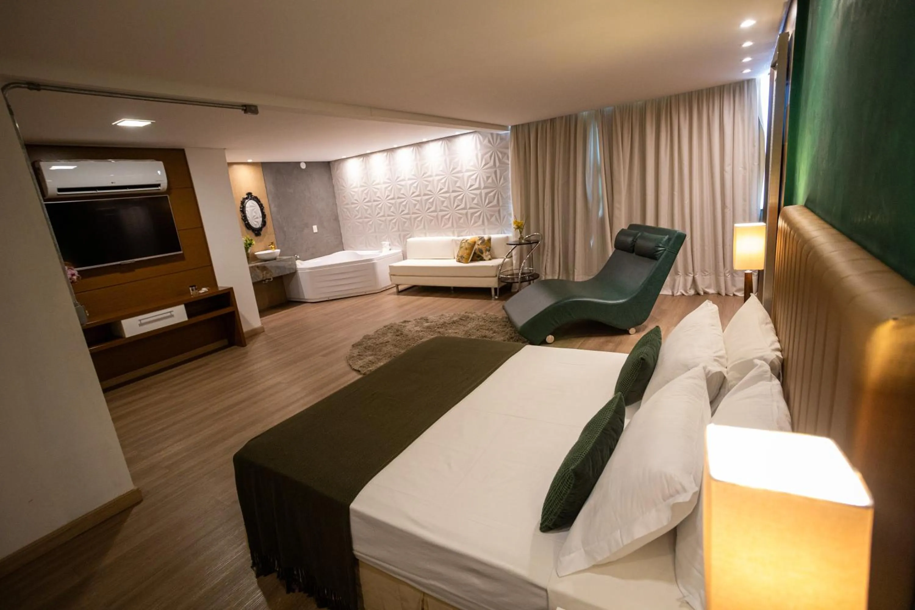 Communal lounge/ TV room, Bed in Alfa Hotel