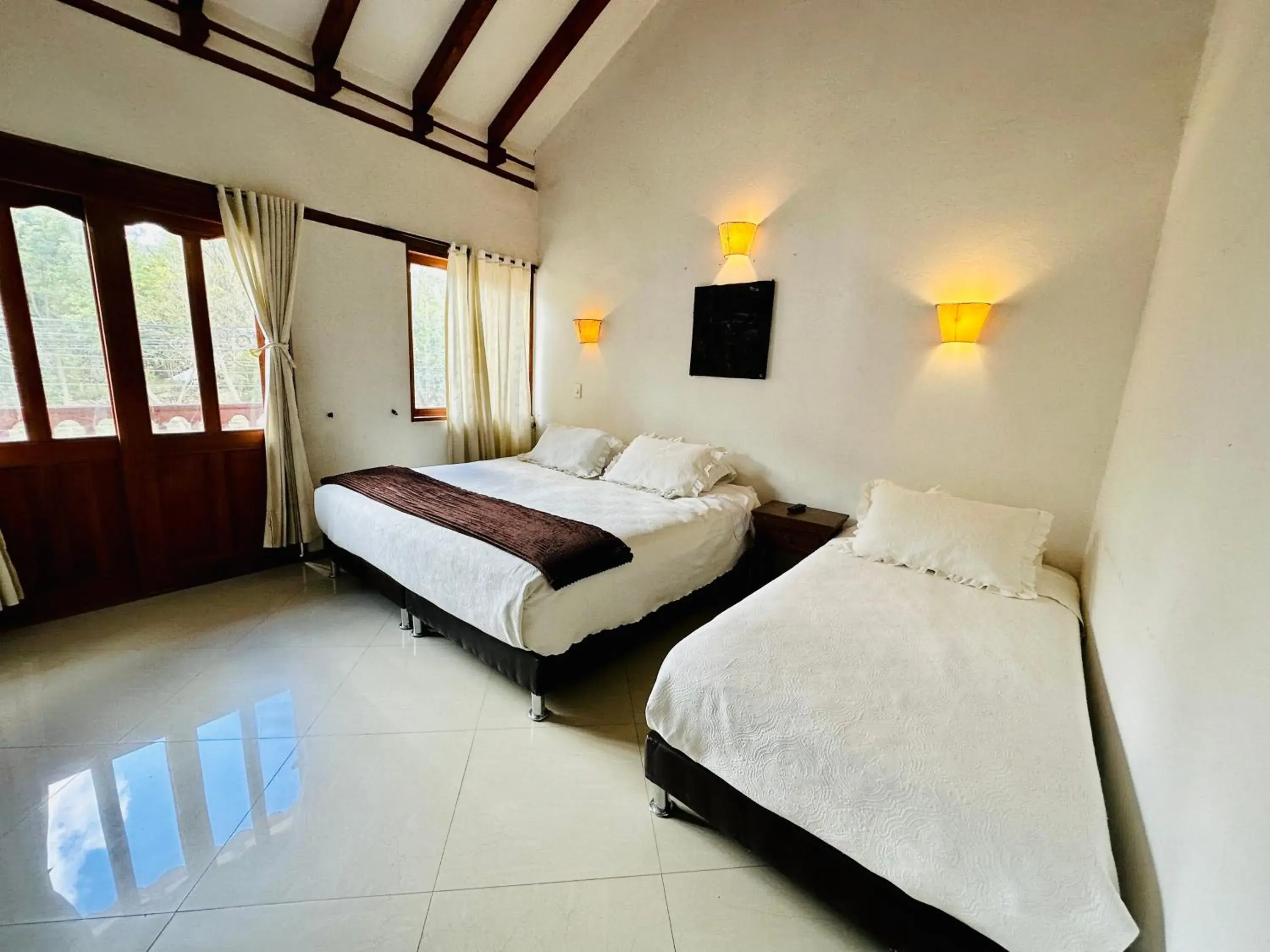 Triple Room with Balcony in Hotel Oasis de la villa Triple Room with Balcony in Hotel Oasis de la villa