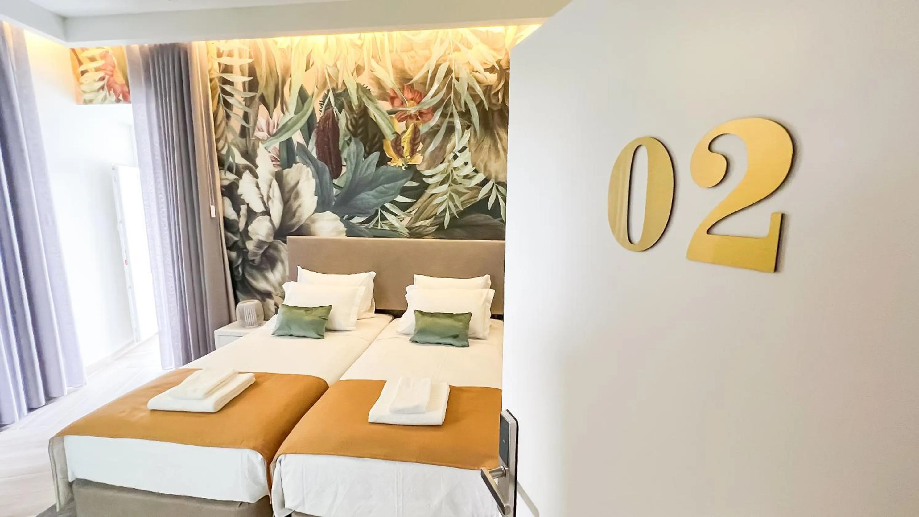 towels, Bed in Guest House Jacarandá Faro