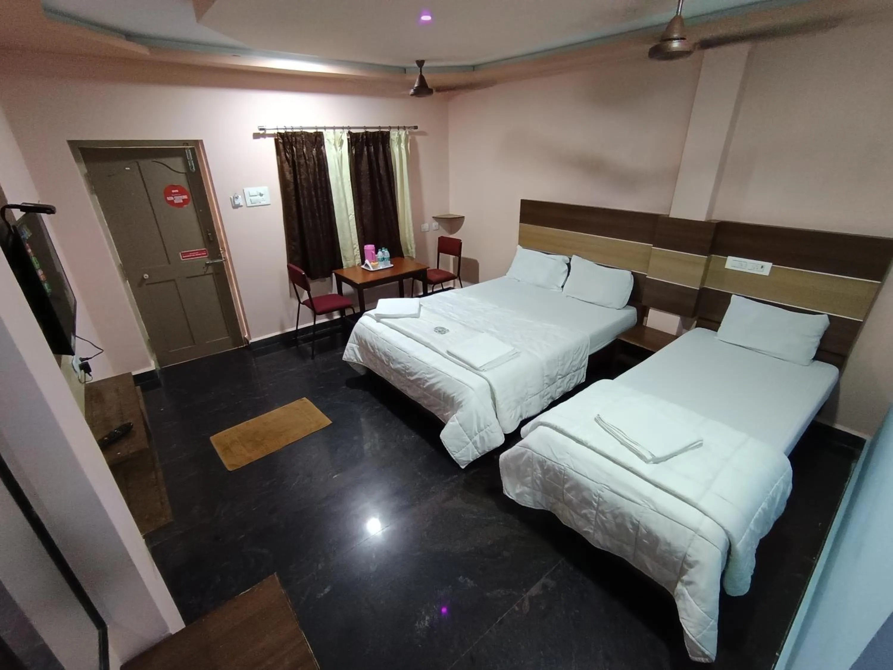 Photo of the whole room, Bed in Sri Murugan Beach Paradise Hotel