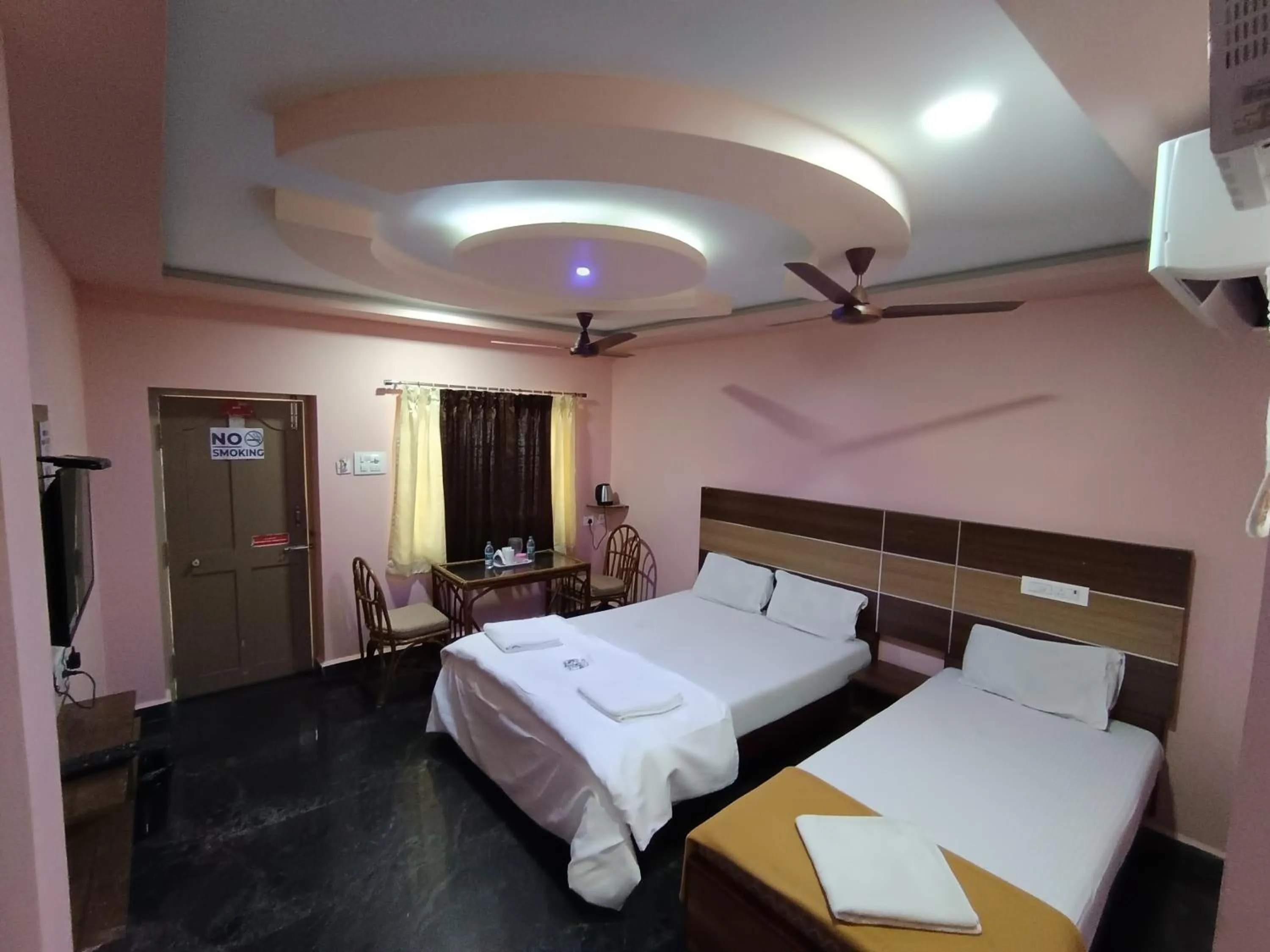 Bed in Sri Murugan Beach Paradise Hotel