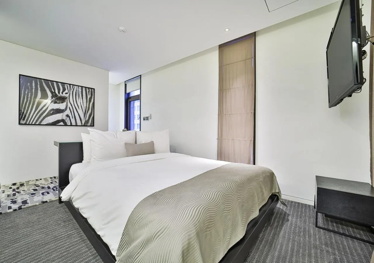 Bed in JS Boutique Hotel