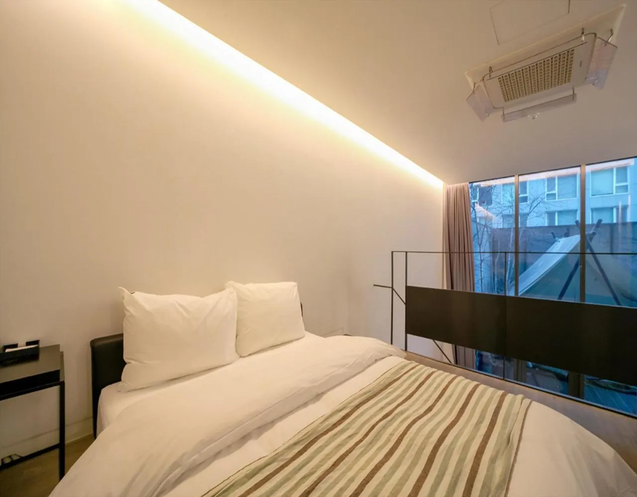 Bed in JS Boutique Hotel