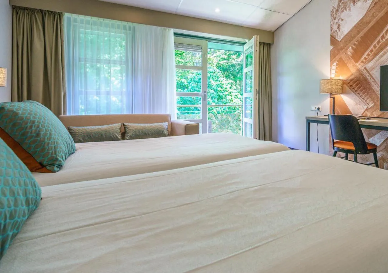 Bed in Parkhotel Tjaarda