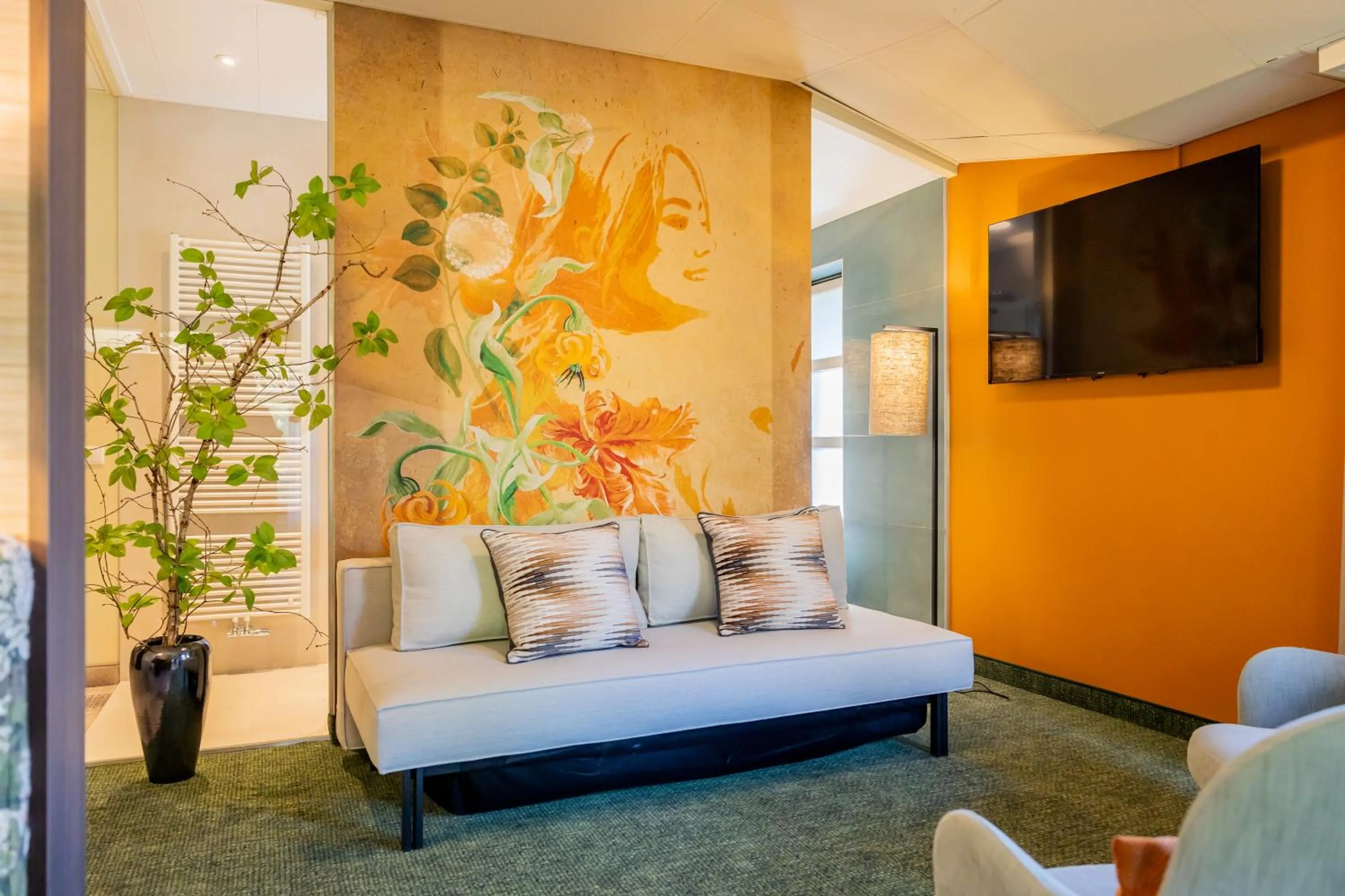 Seating area, Bed in Parkhotel Tjaarda