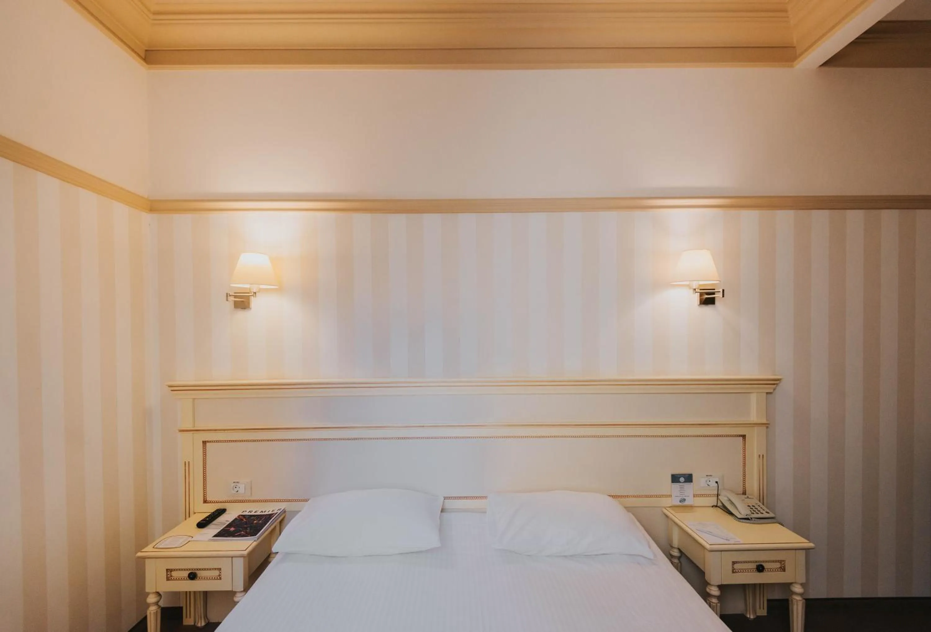 Bed in Premier Geneva Hotel