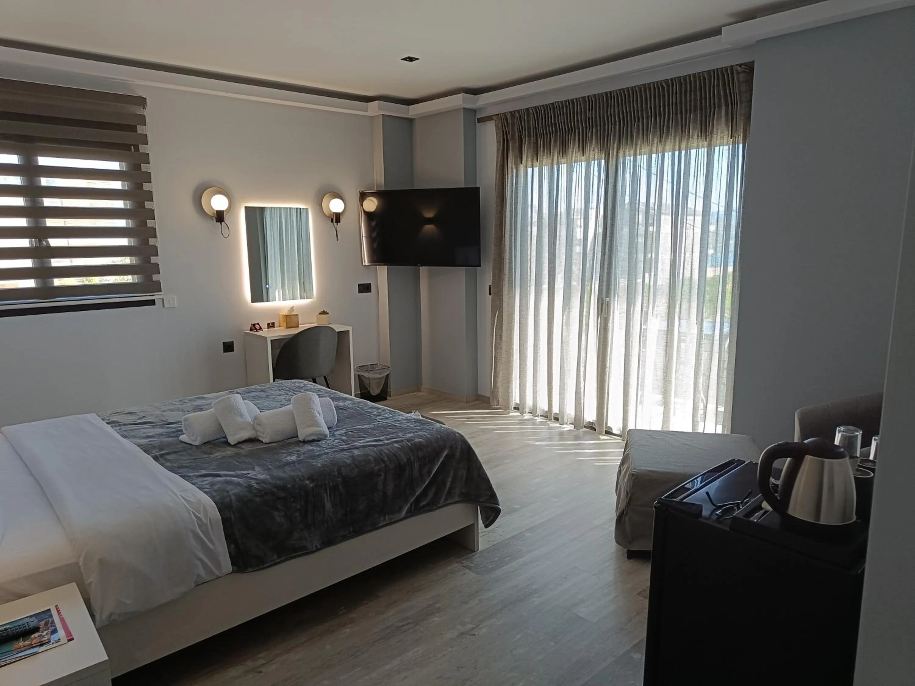 Bed in Oikos 9 Rooms and Suites