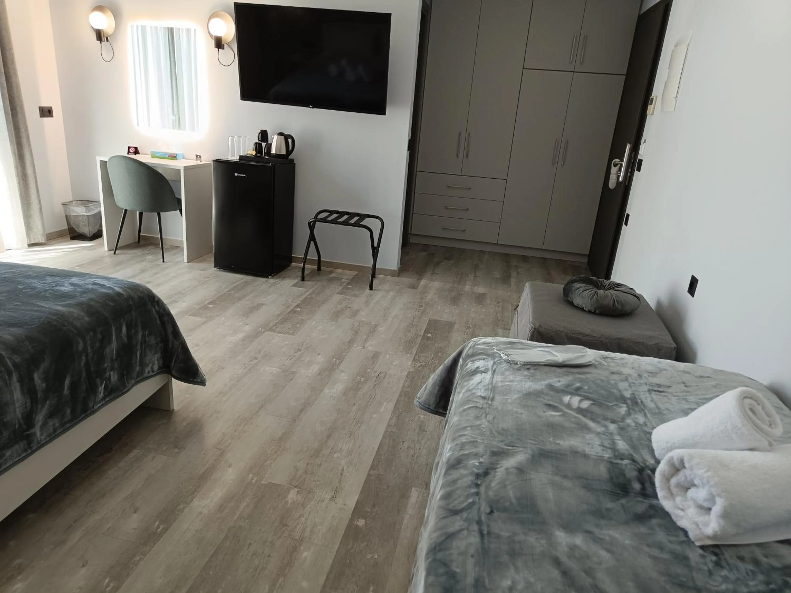 Bed in Oikos 9 Rooms and Suites