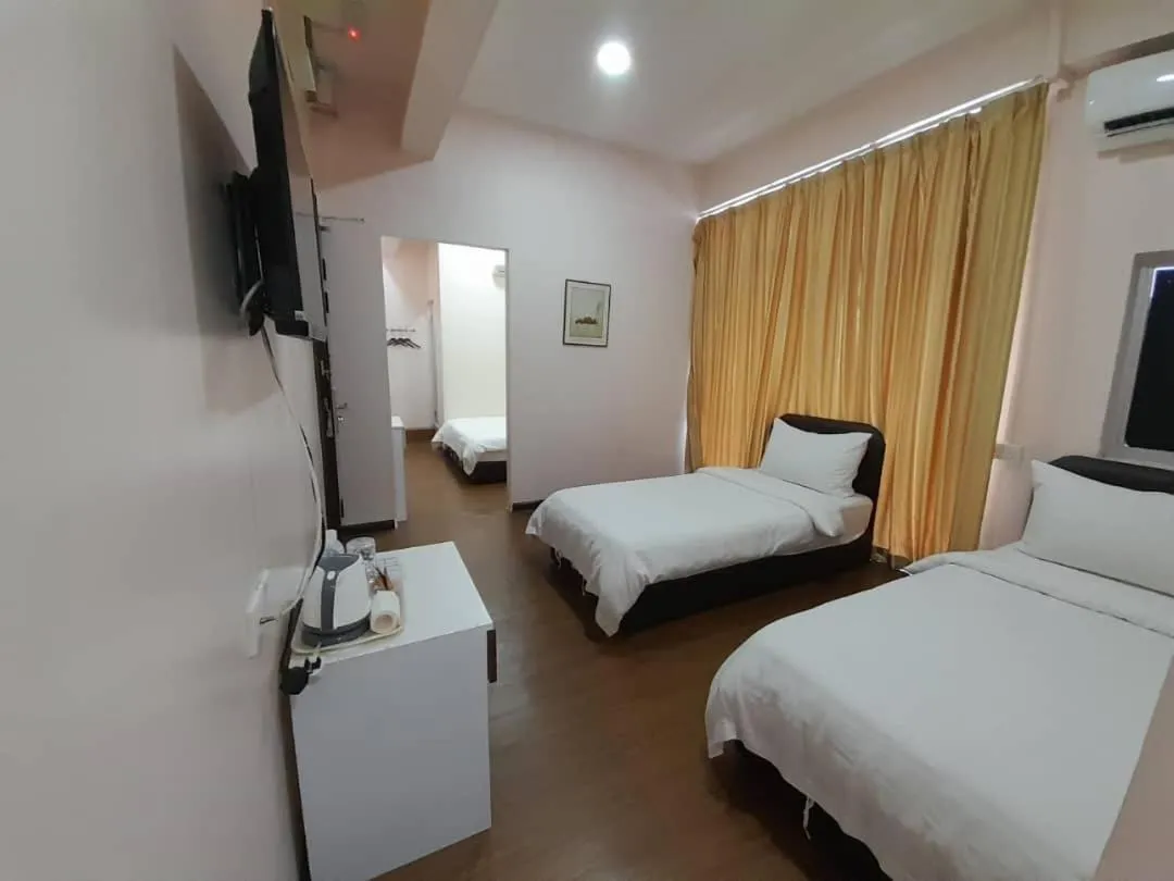 Bed in Sipadan Crystal Haven Inn