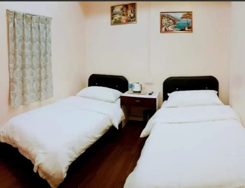 Bed in Sipadan Crystal Haven Inn Bed in Sipadan Crystal Haven Inn