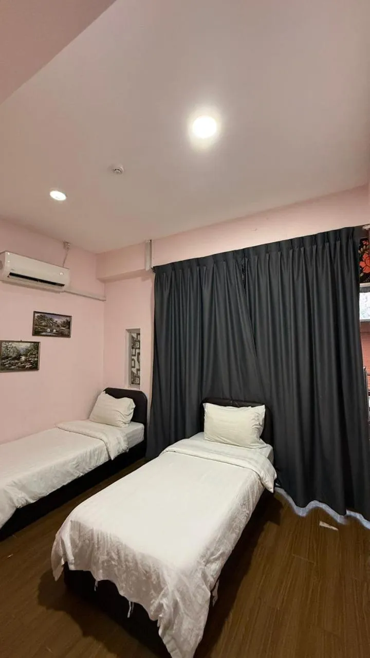 Bed in Sipadan Crystal Haven Inn