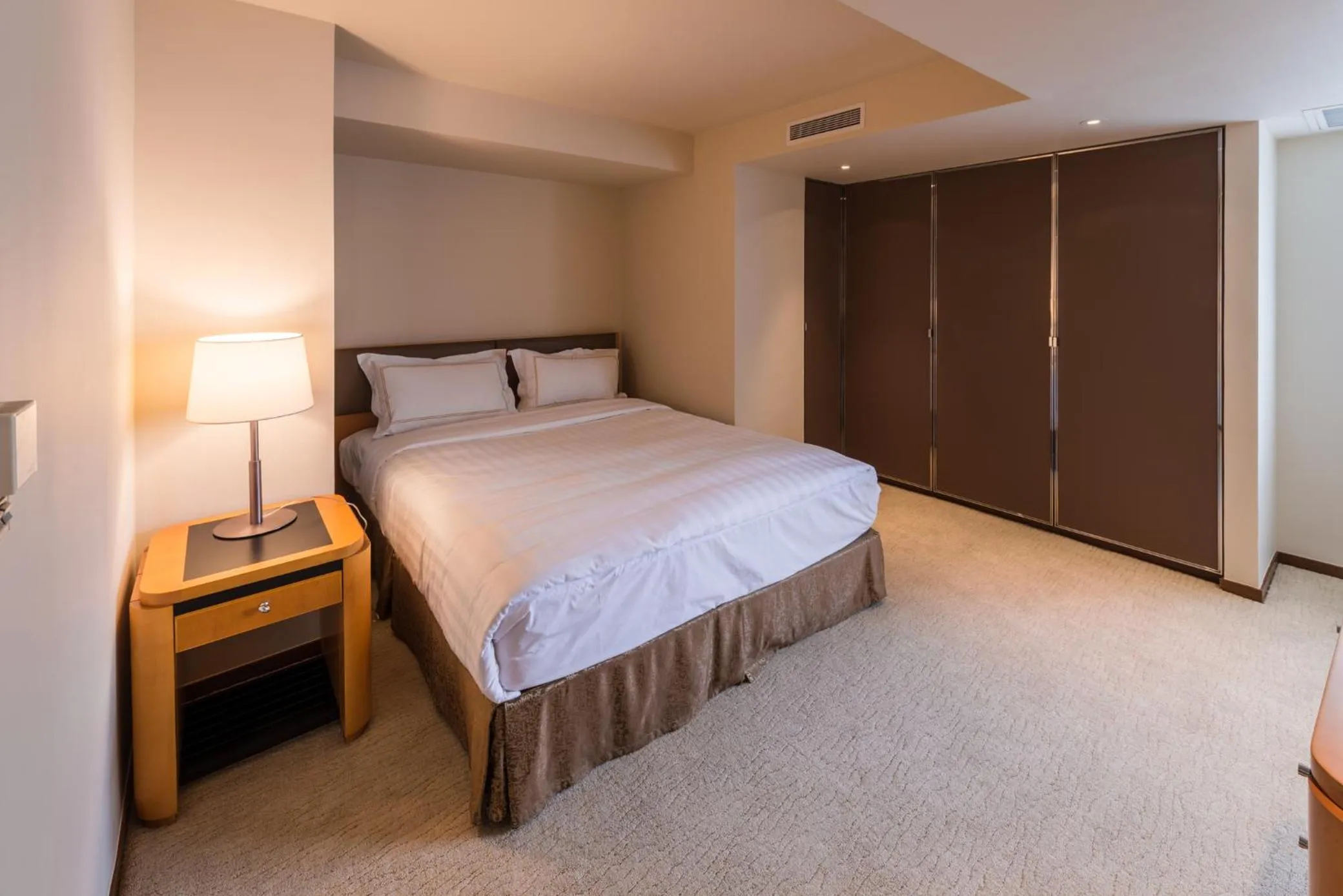 Bed in Shanghai Centre Serviced Apartment