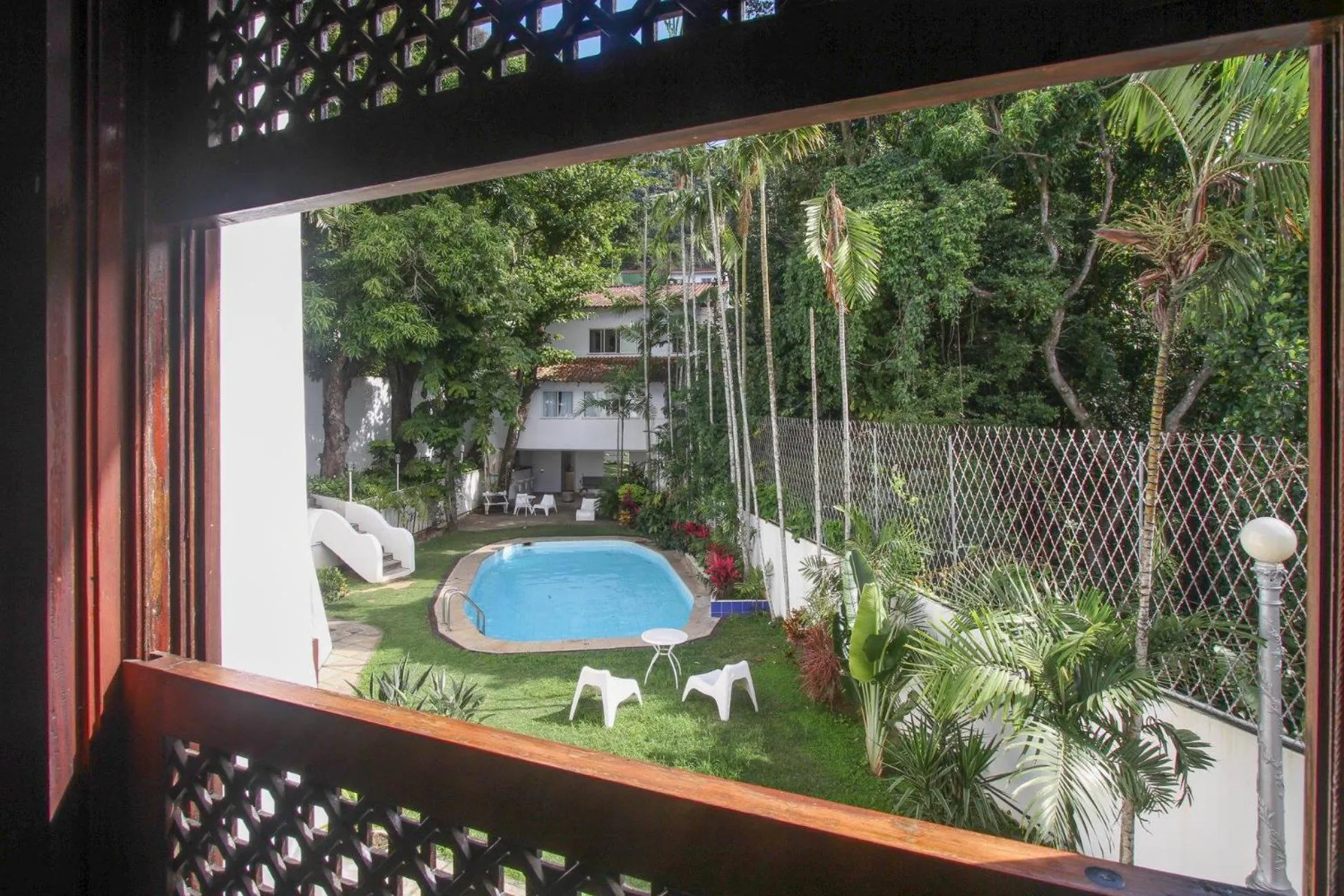 Bedroom in Les Jardins de Rio Boutique Hotel
