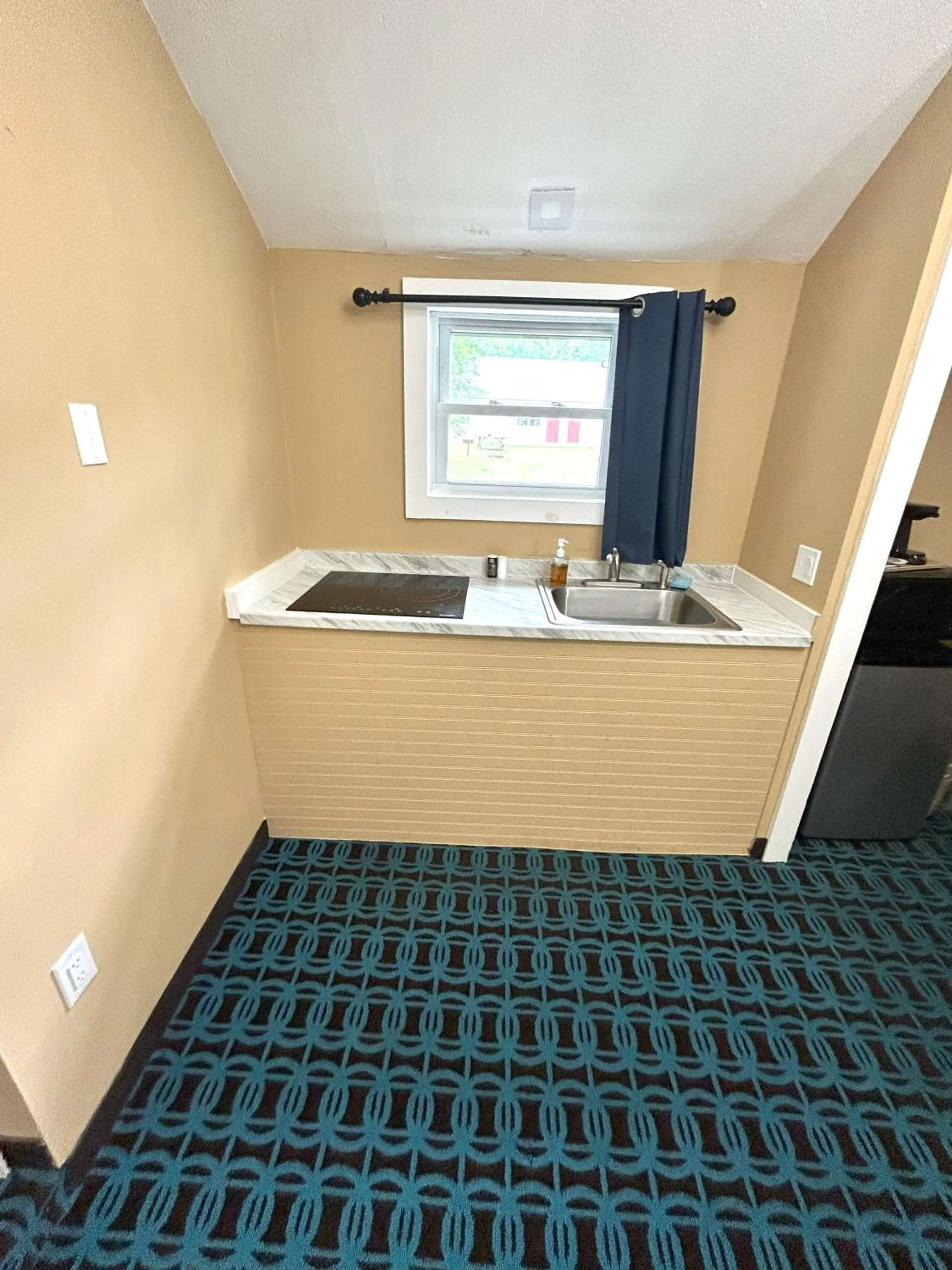 kitchen in The Villager Motel