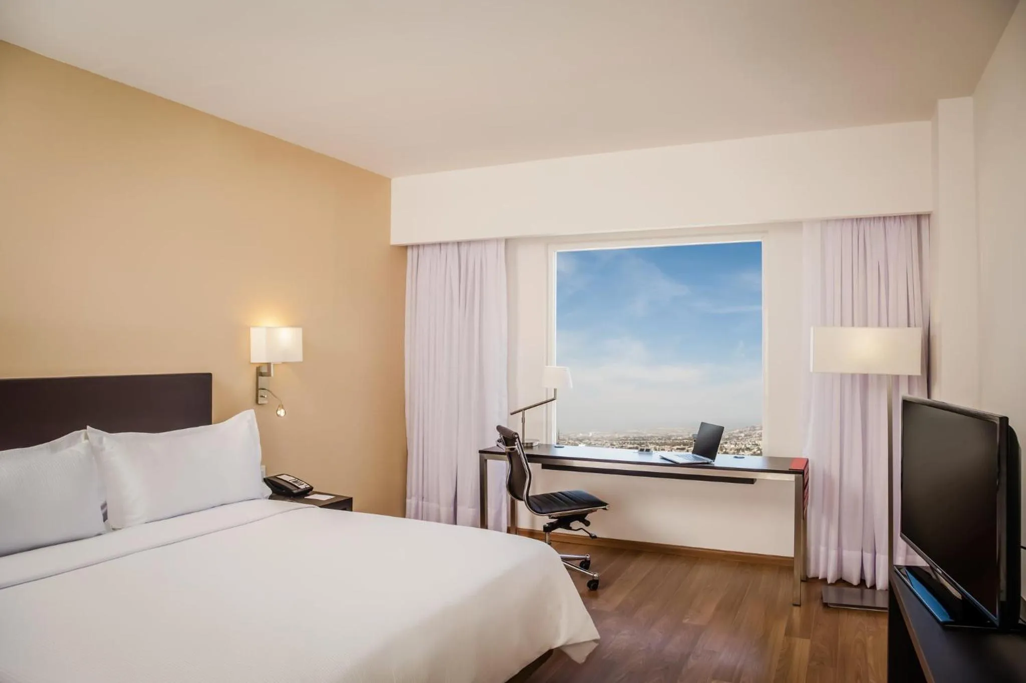 Photo of the whole room, Bed in Fiesta Inn Queretaro Centro Sur