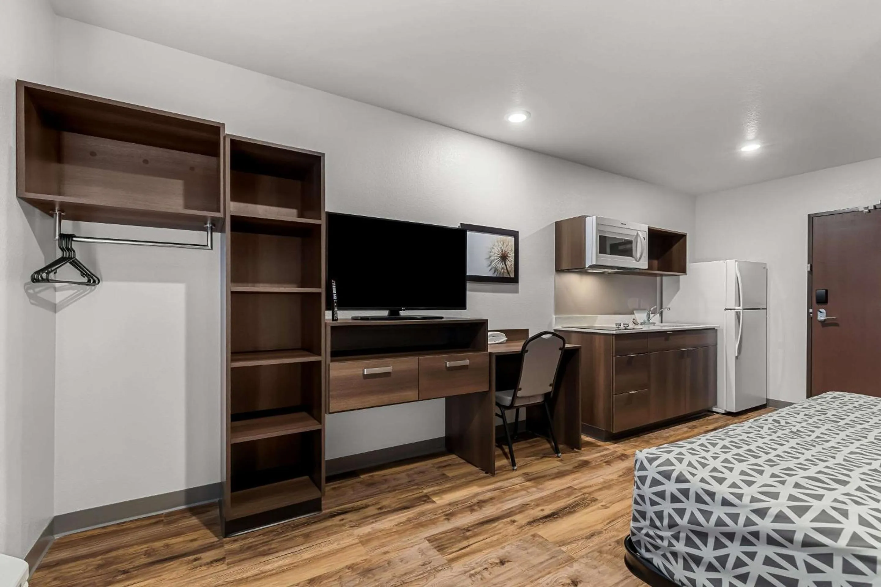 Bedroom, Bed in WoodSpring Suites Corona