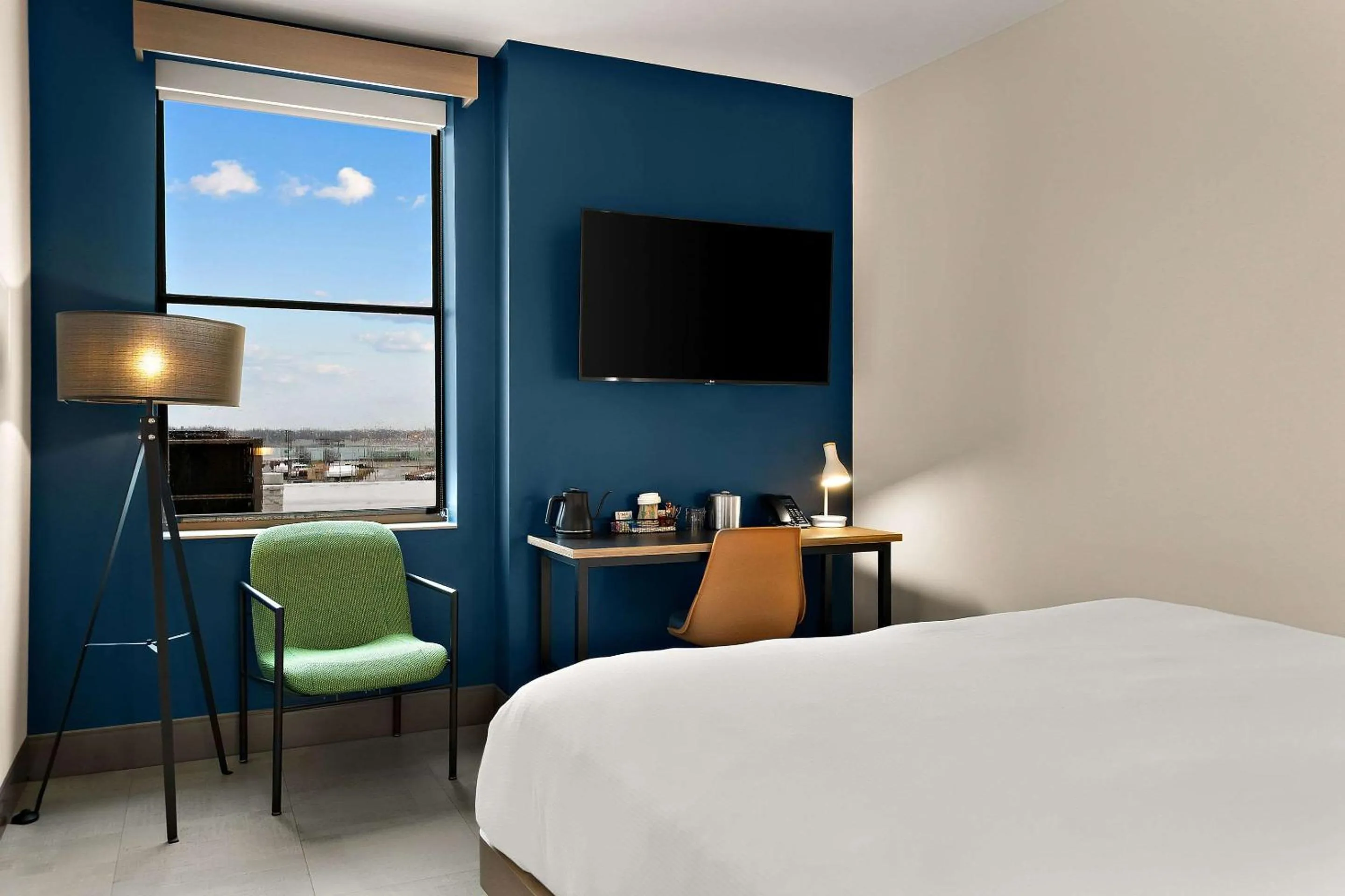 Bedroom in CityFlatsHotel - Port Huron, an Ascend Collection Hotel